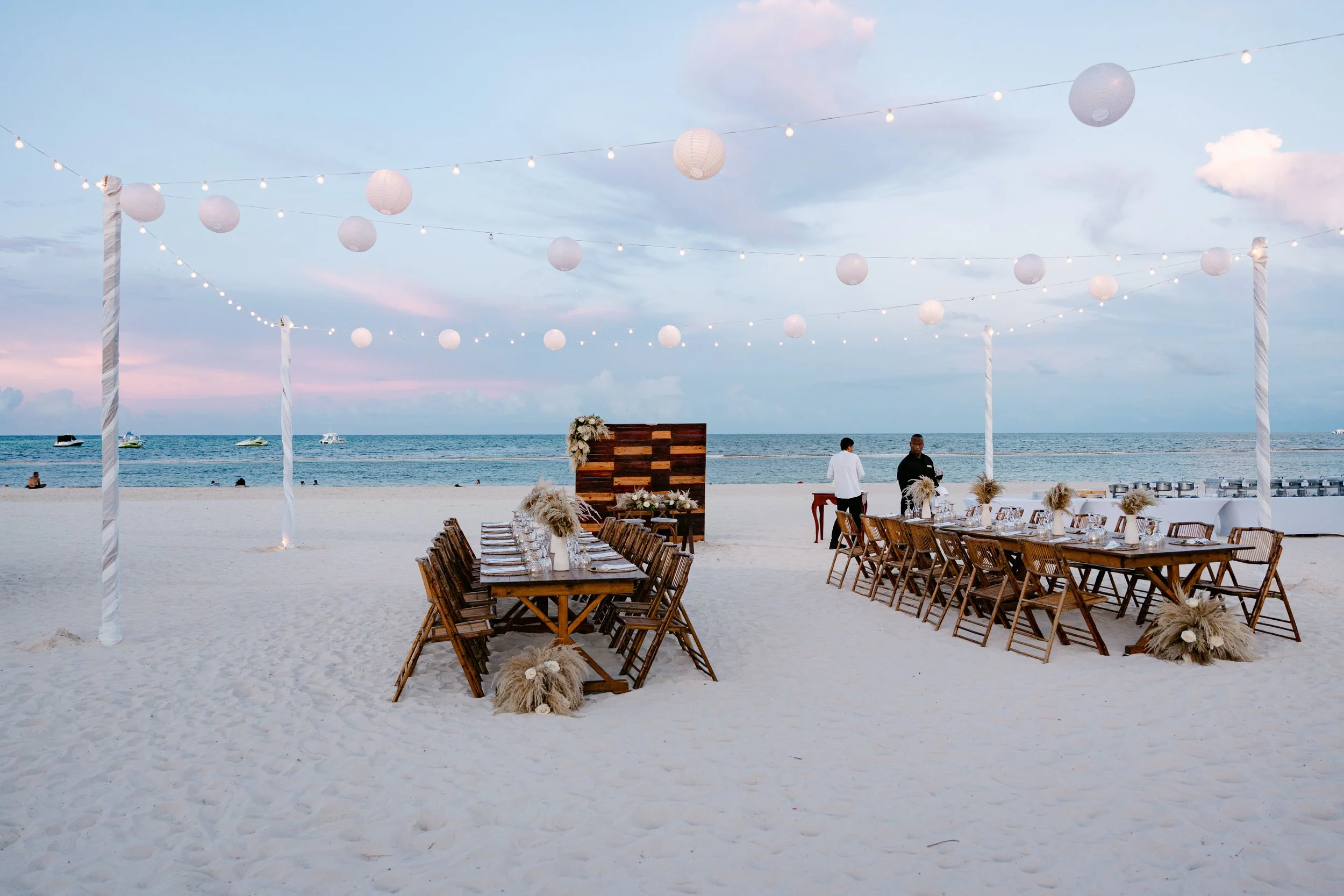secrets-royal-beach-beach-reception-setup-sunset.jpg