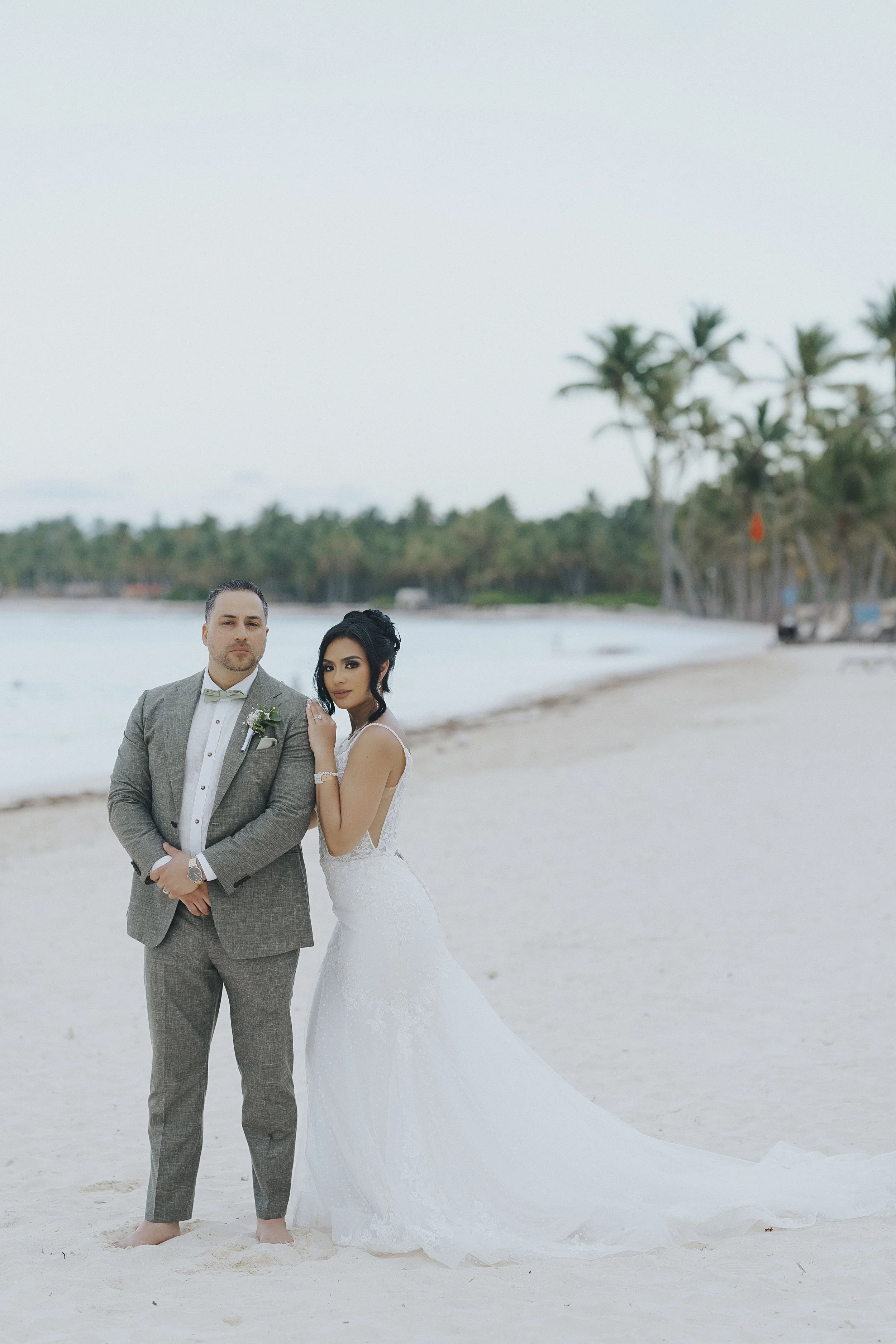 Bride and groom taking a quiet walk along the shore just after the ceremony