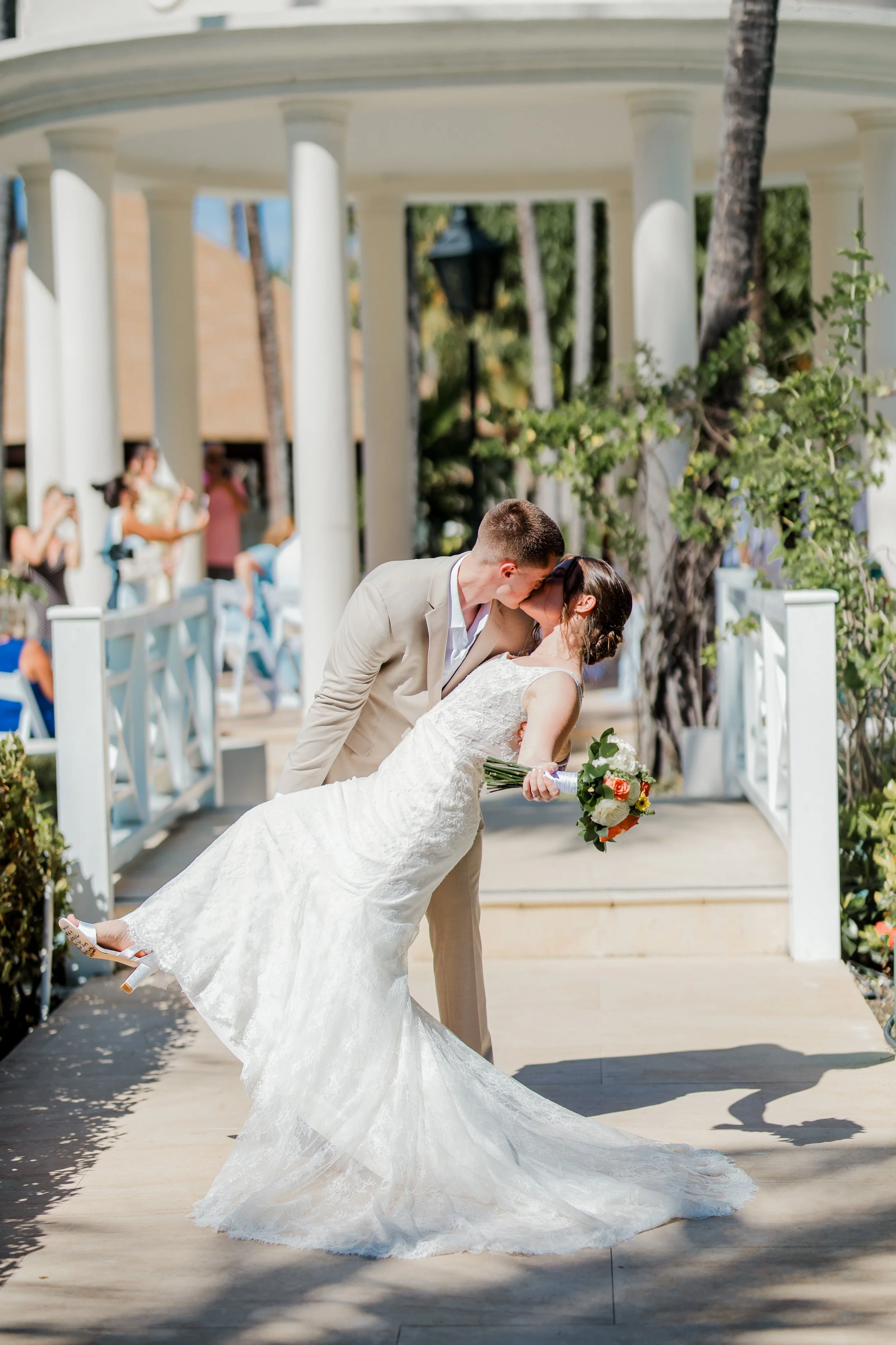 Groom dipping bride for a kiss under the gazebo at Majestic Colonial Punta Cana