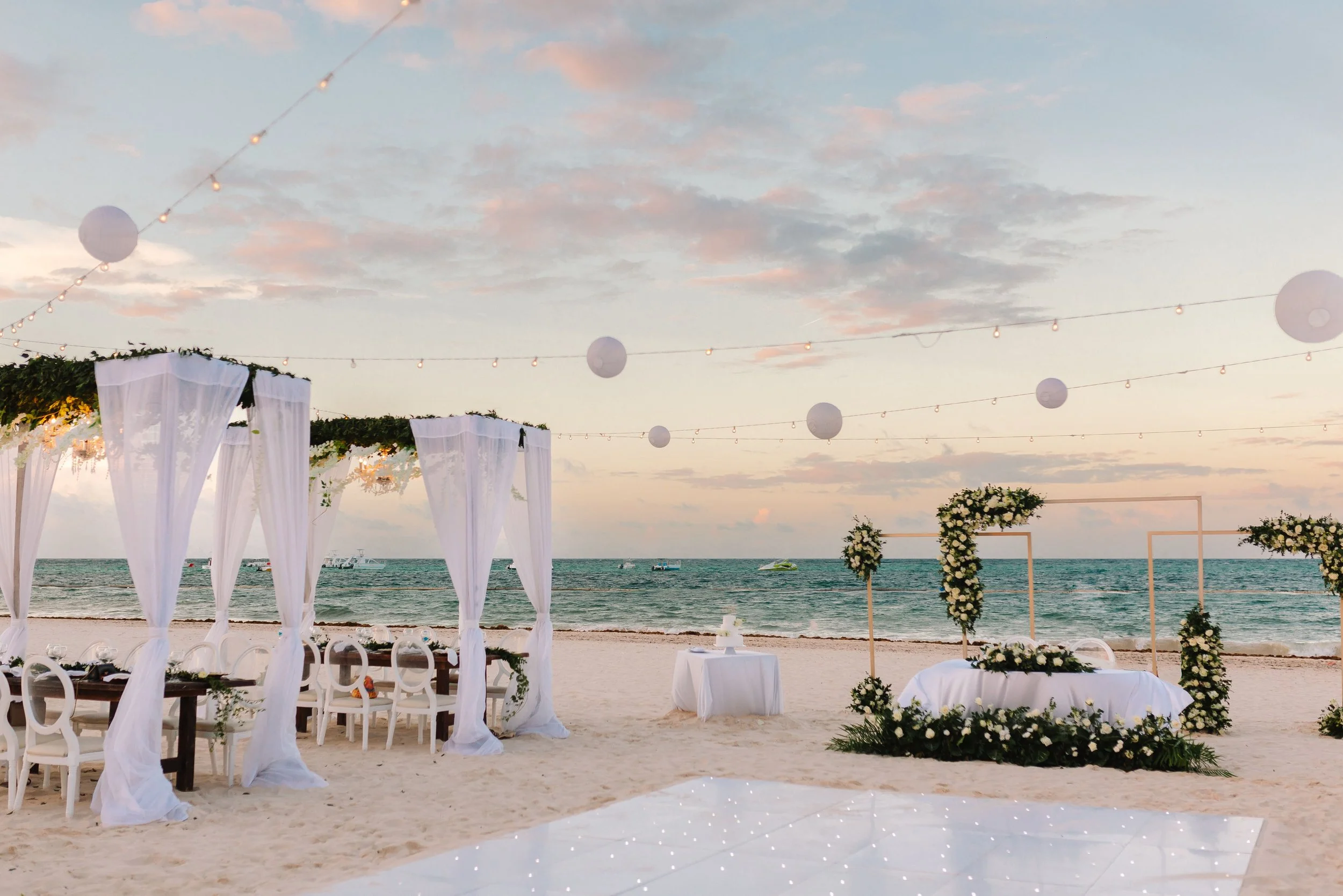 Beachfront wedding reception setup at sunset at Secrets Royal Beach Punta Cana
