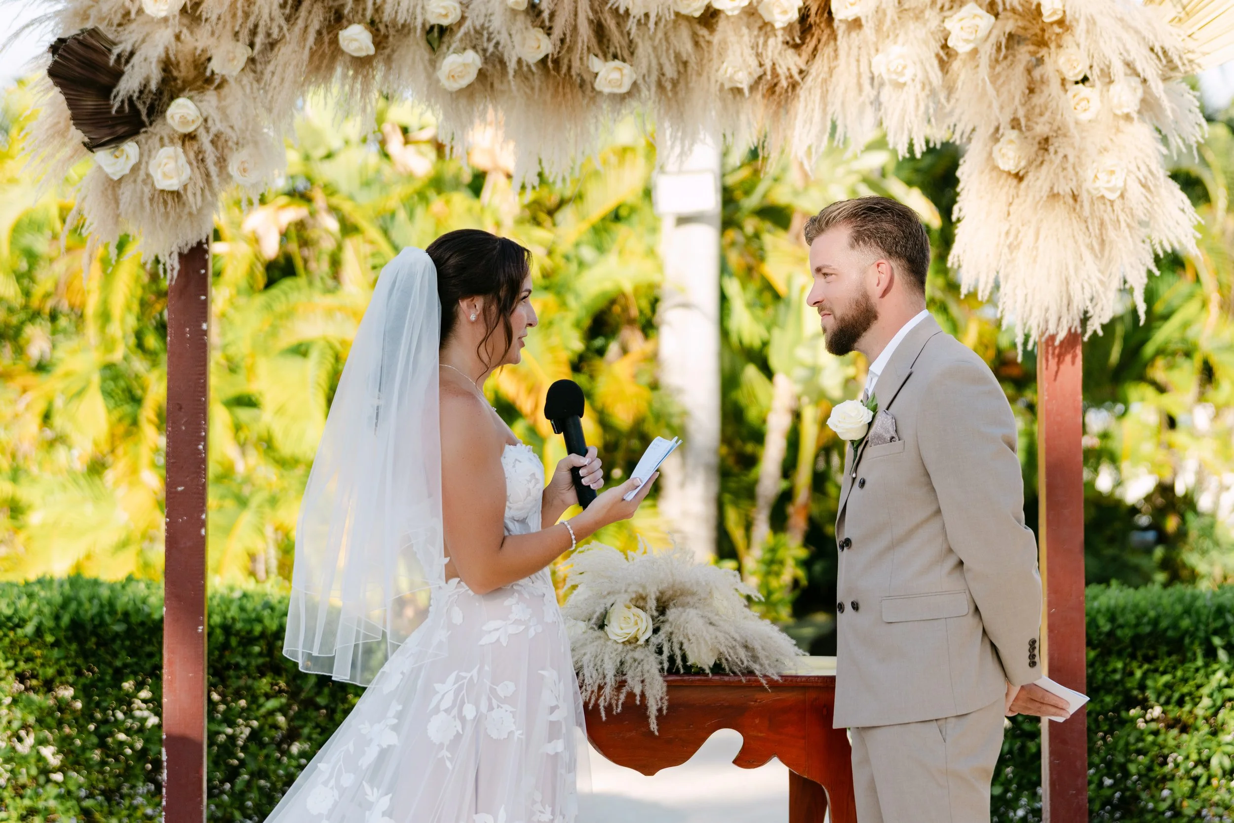 secrets-royal-beach-ceremony-pampas-arch-vows.jpg