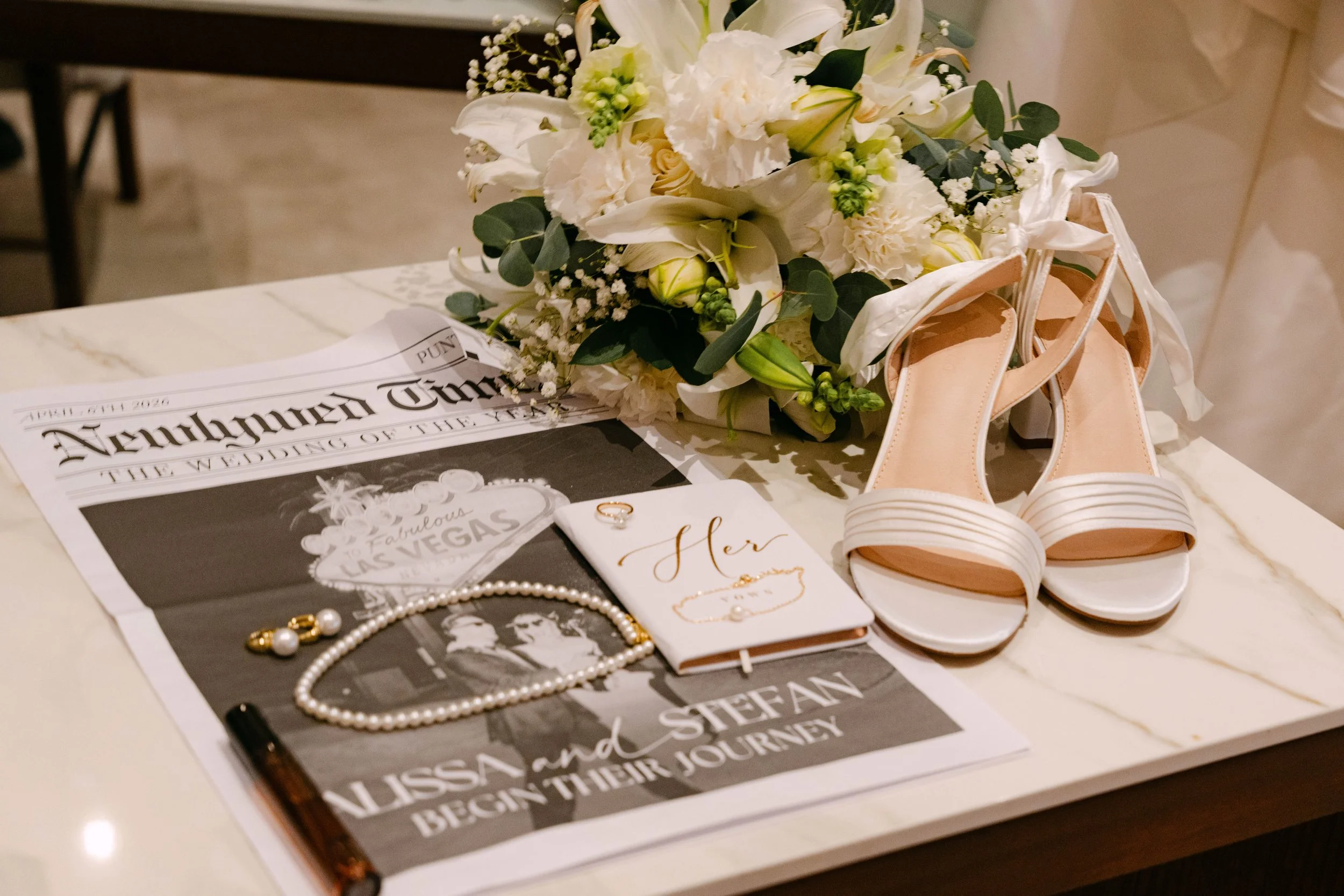 Newspaper-style wedding invitation and details at a Secrets Tides wedding in Punta Cana