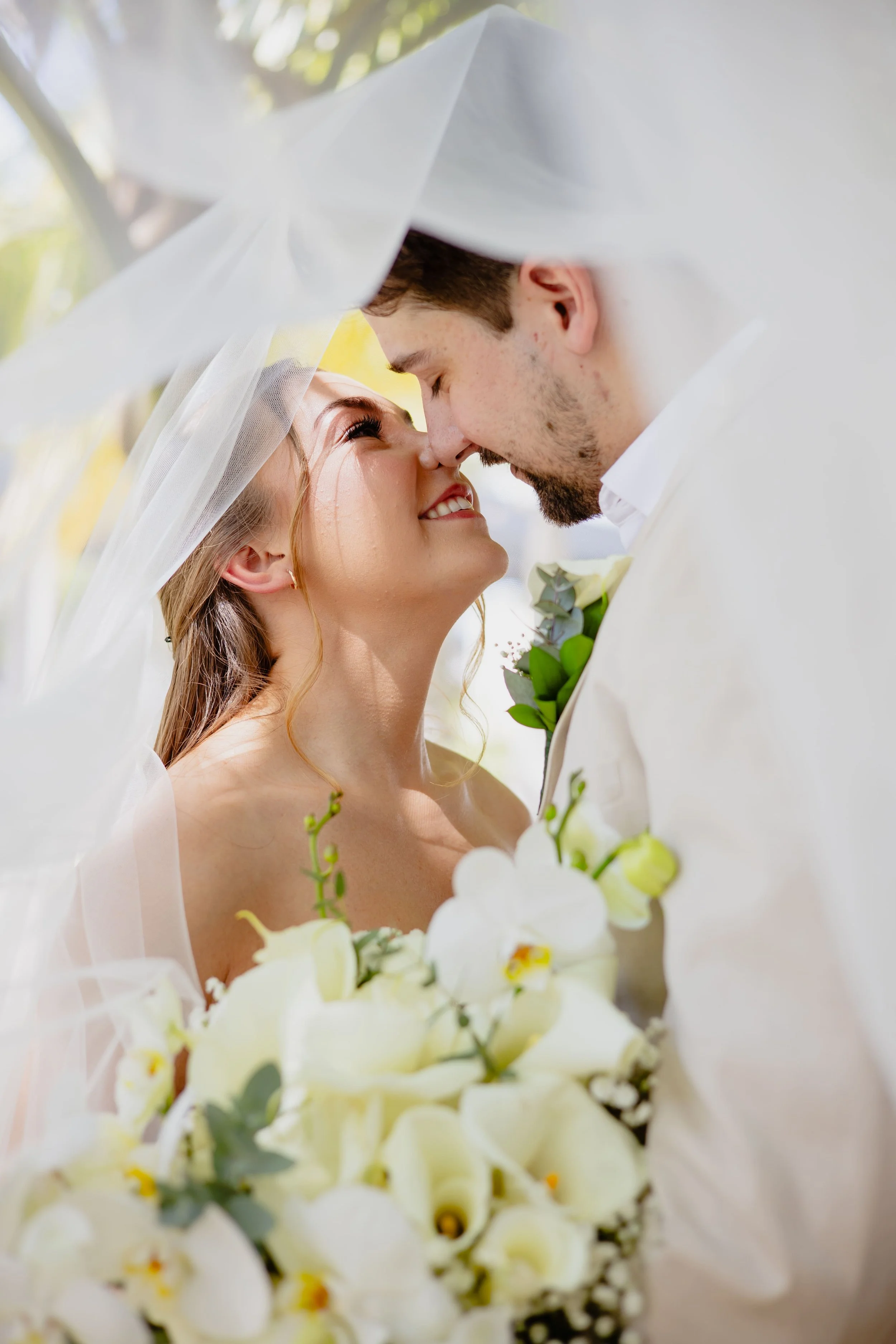 Bride and groom nose to nose under her veil during their Punta Cana first look