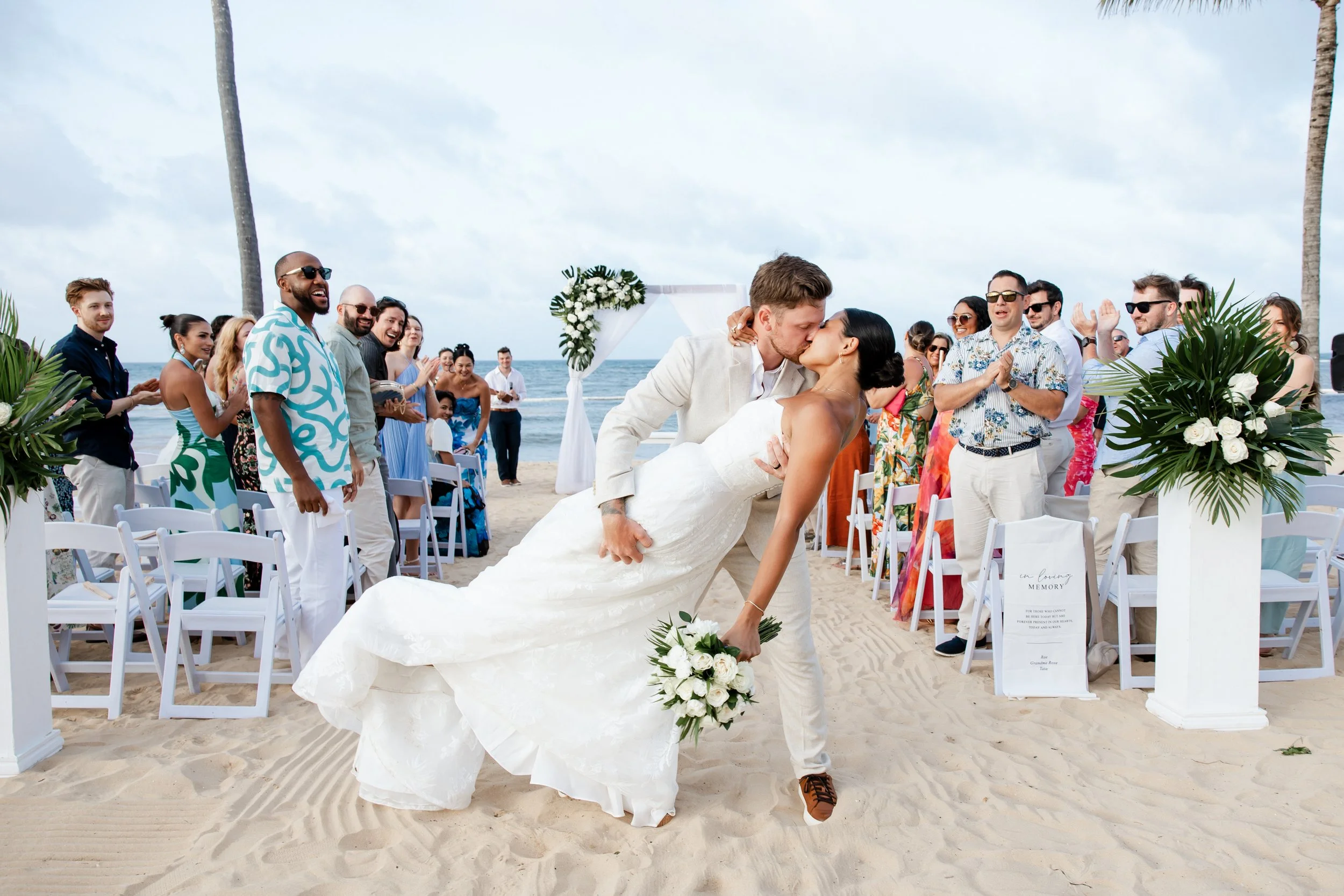 secrets-tides-recessional-dip-kiss-guests-cheering.jpg