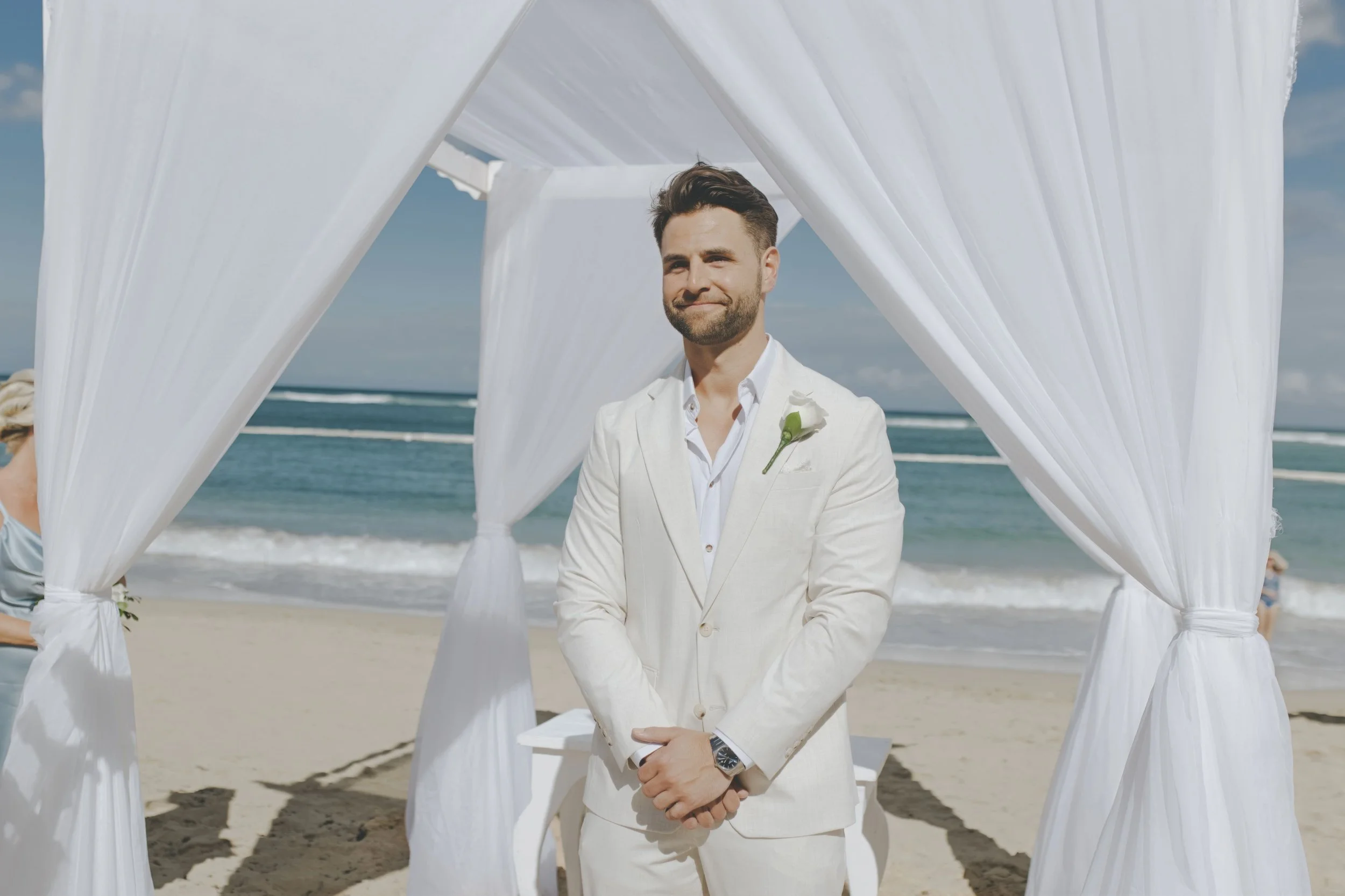 Groom waiting at the beach gazebo before his ceremony in Punta Cana