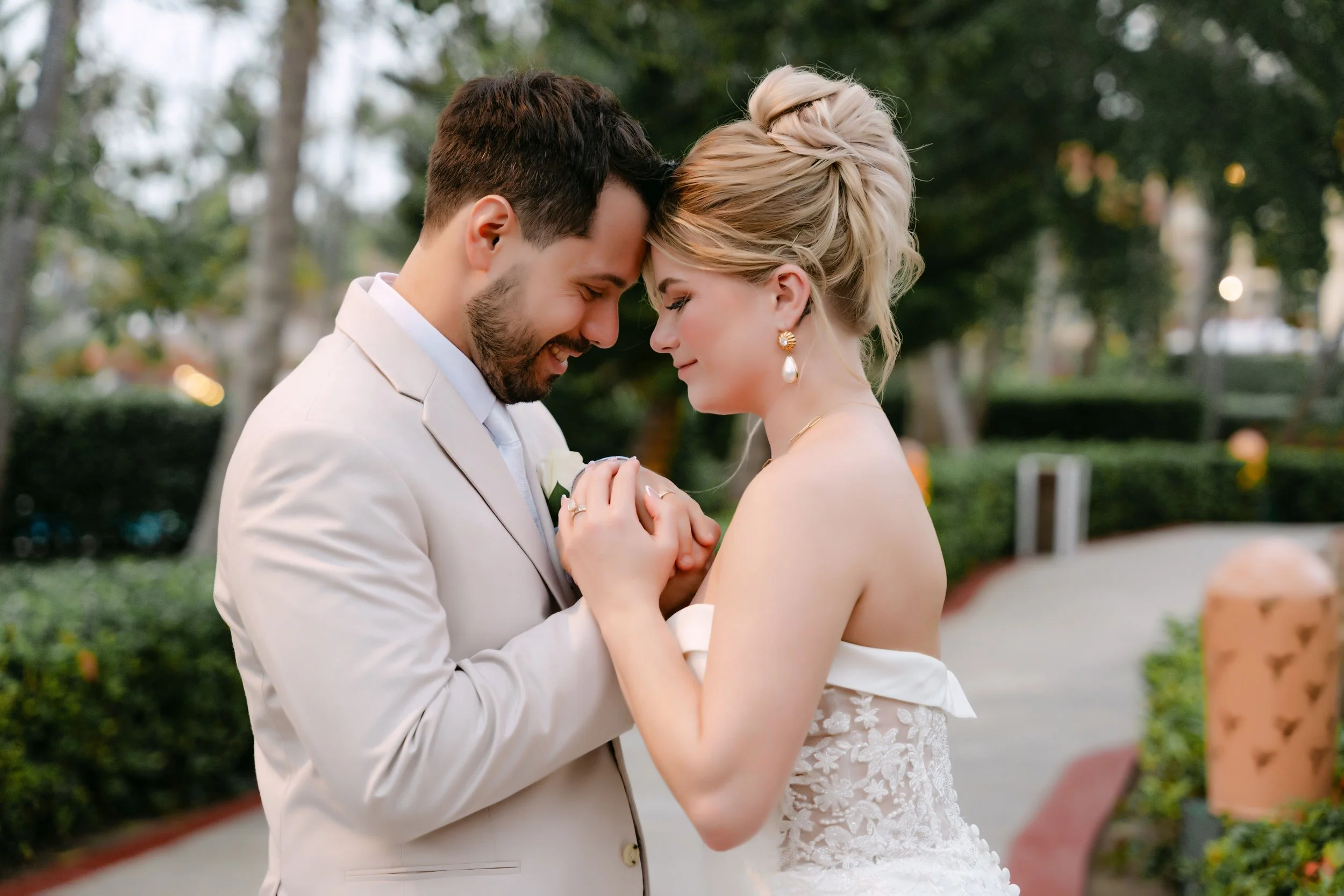 Bride and groom sharing a tender forehead-to-forehead moment during their Majestic wedding portraits in Punta Cana