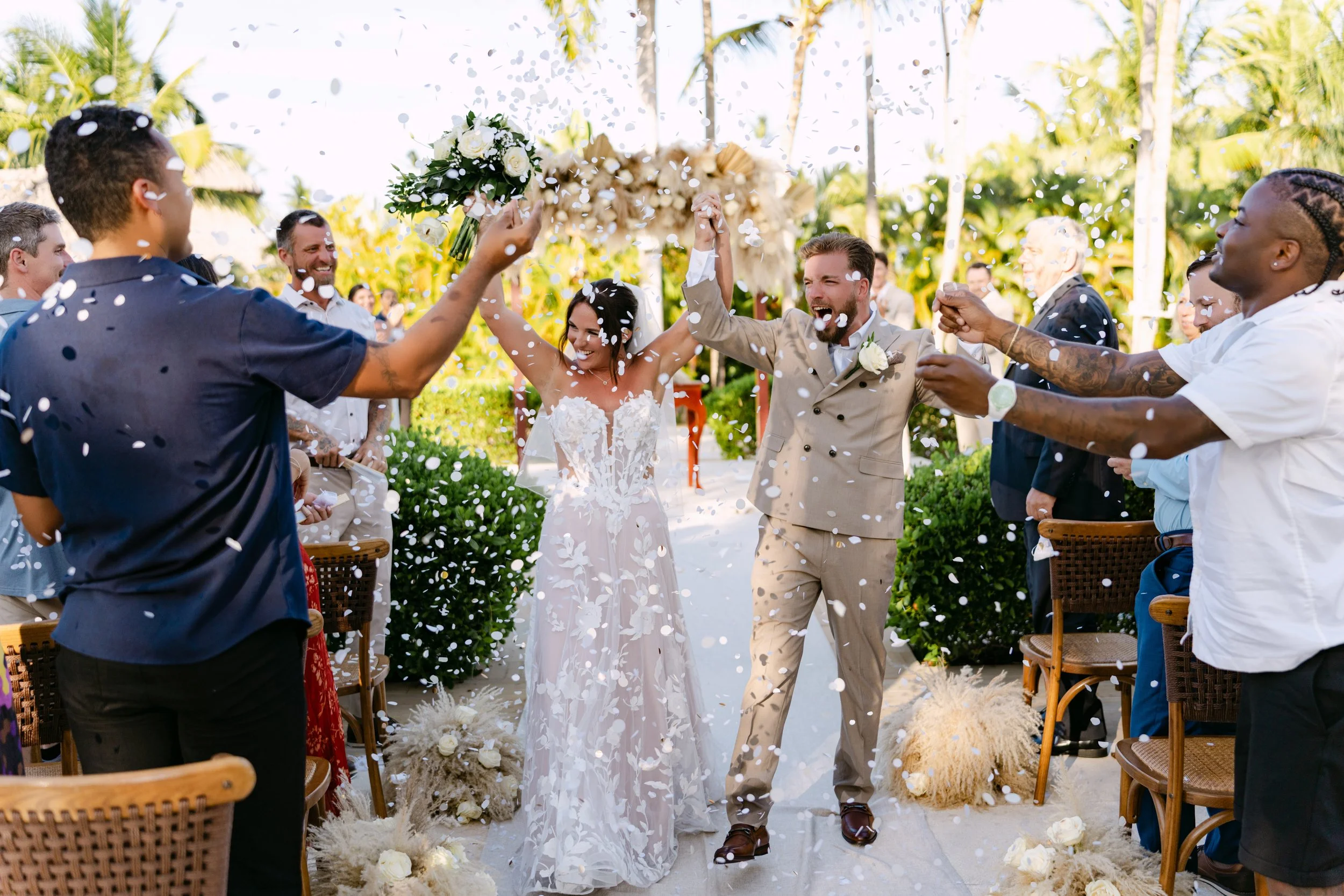 nicole-devon-secrets-royal-beach-wedding-recessional-confetti.jpg