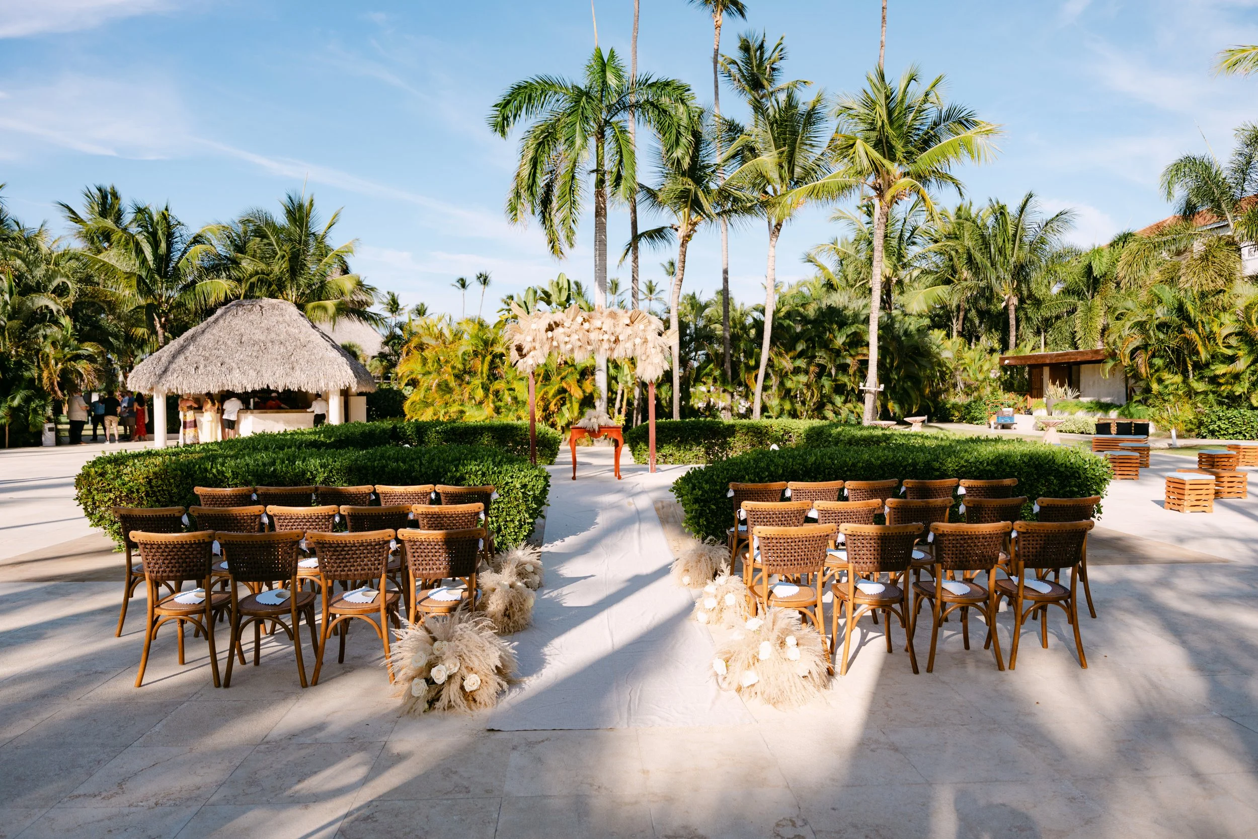 secrets-royal-beach-garden-ceremony-setup-pampas-aisle.jpg