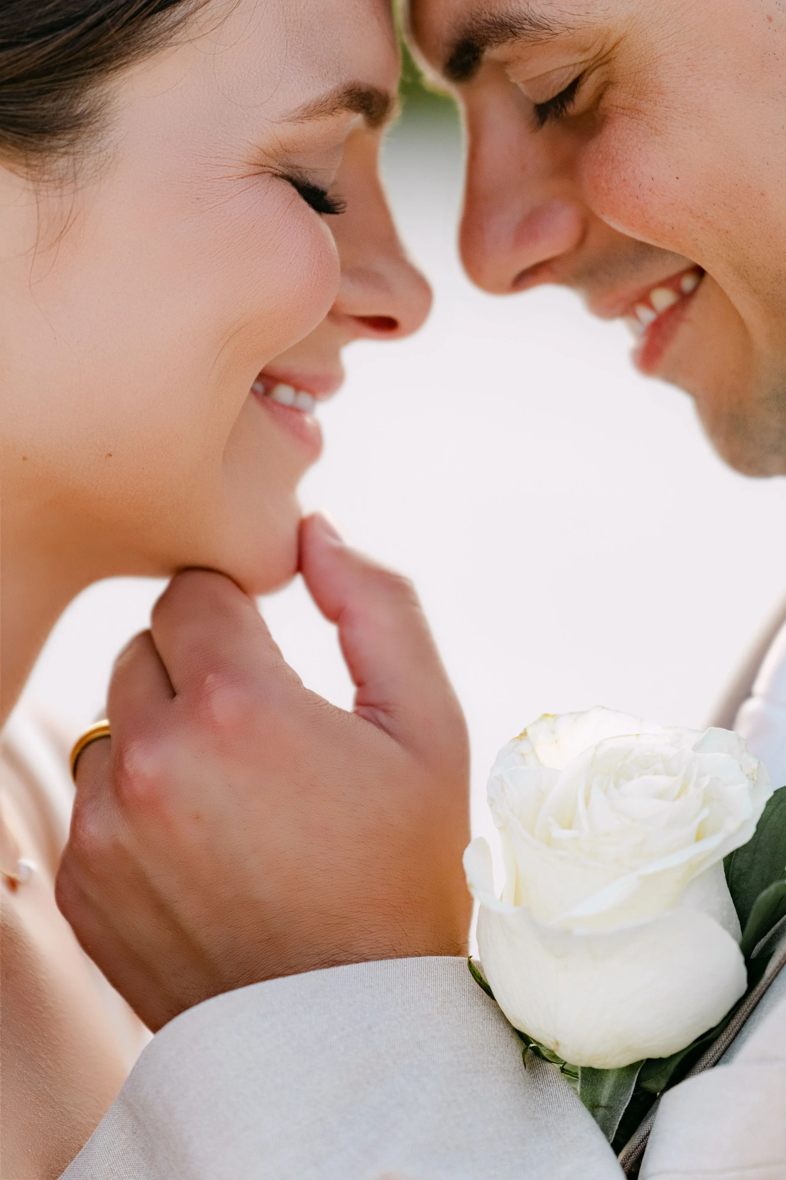 Bride and groom nose to nose laughing together, real wedding at Dreams Royal Beach Punta Cana.