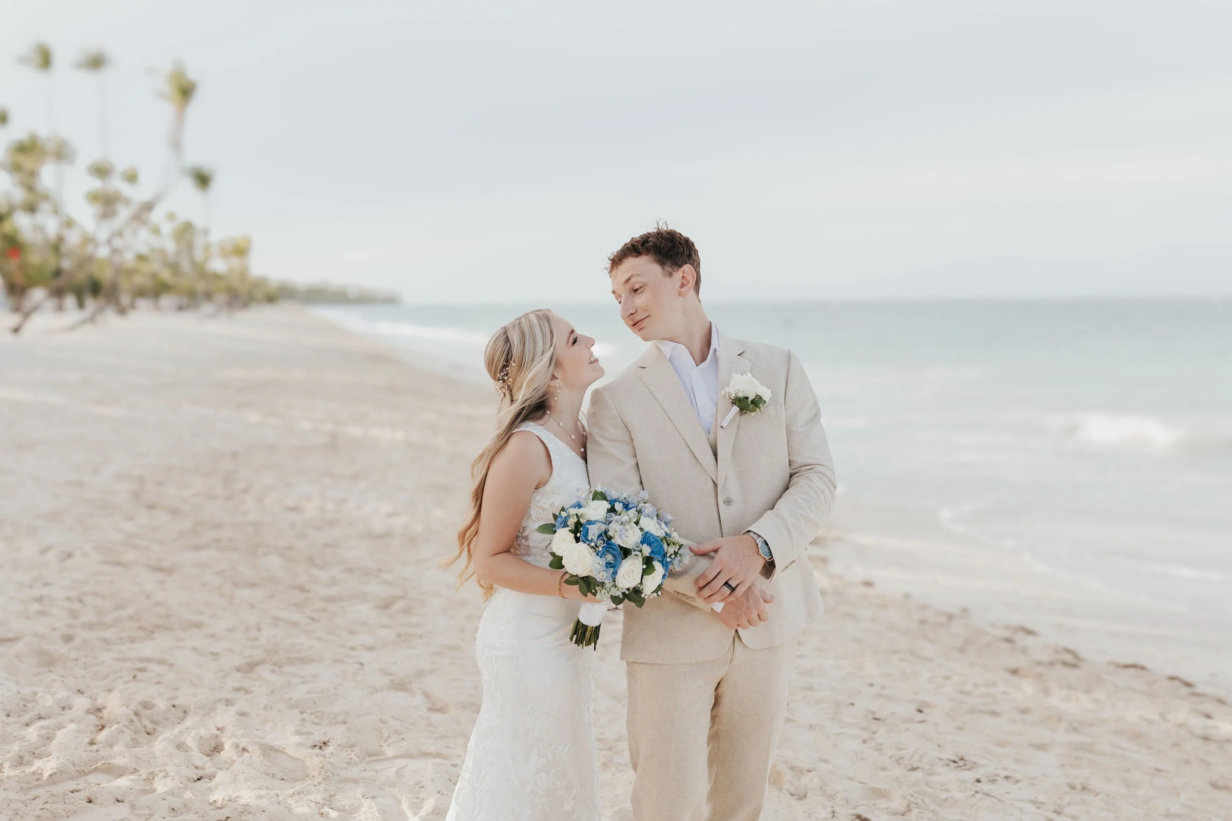 Bride and groom sharing an intimate moment on the beach at their Riu Punta Cana wedding