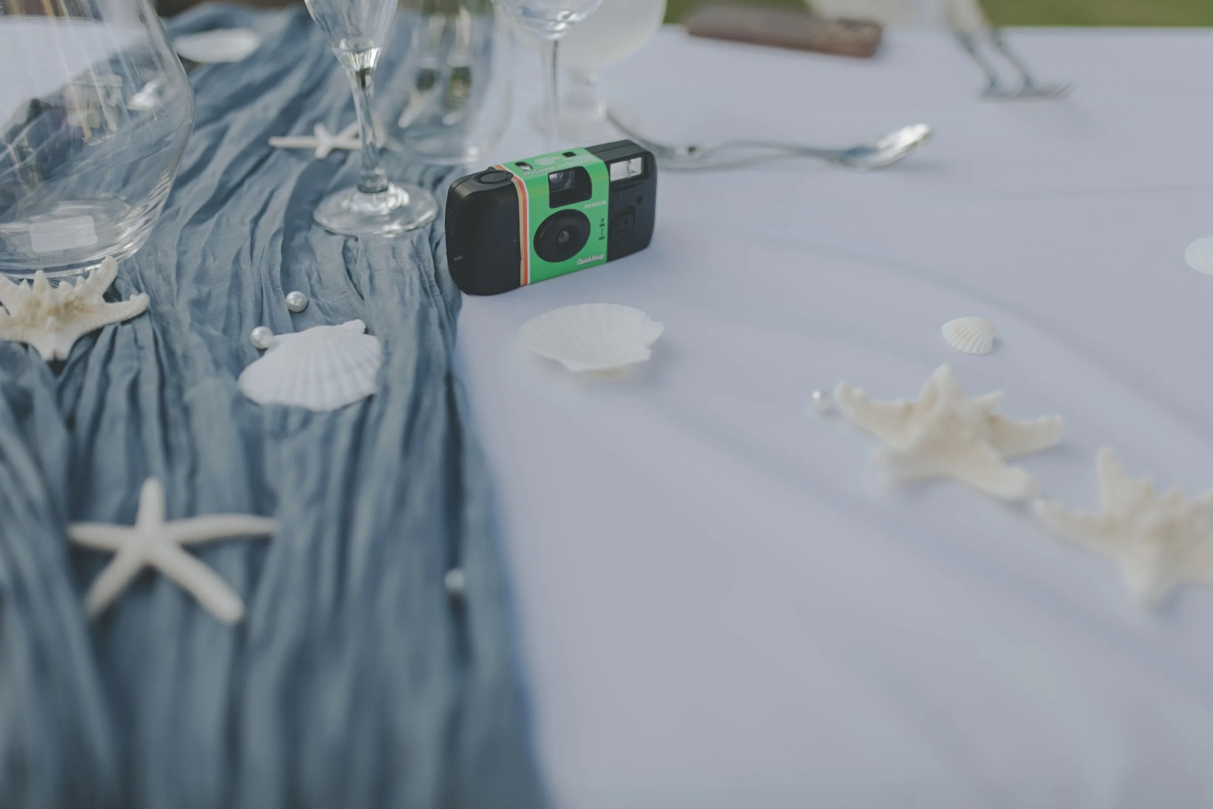Disposable camera on a table setting at a Punta Cana wedding reception