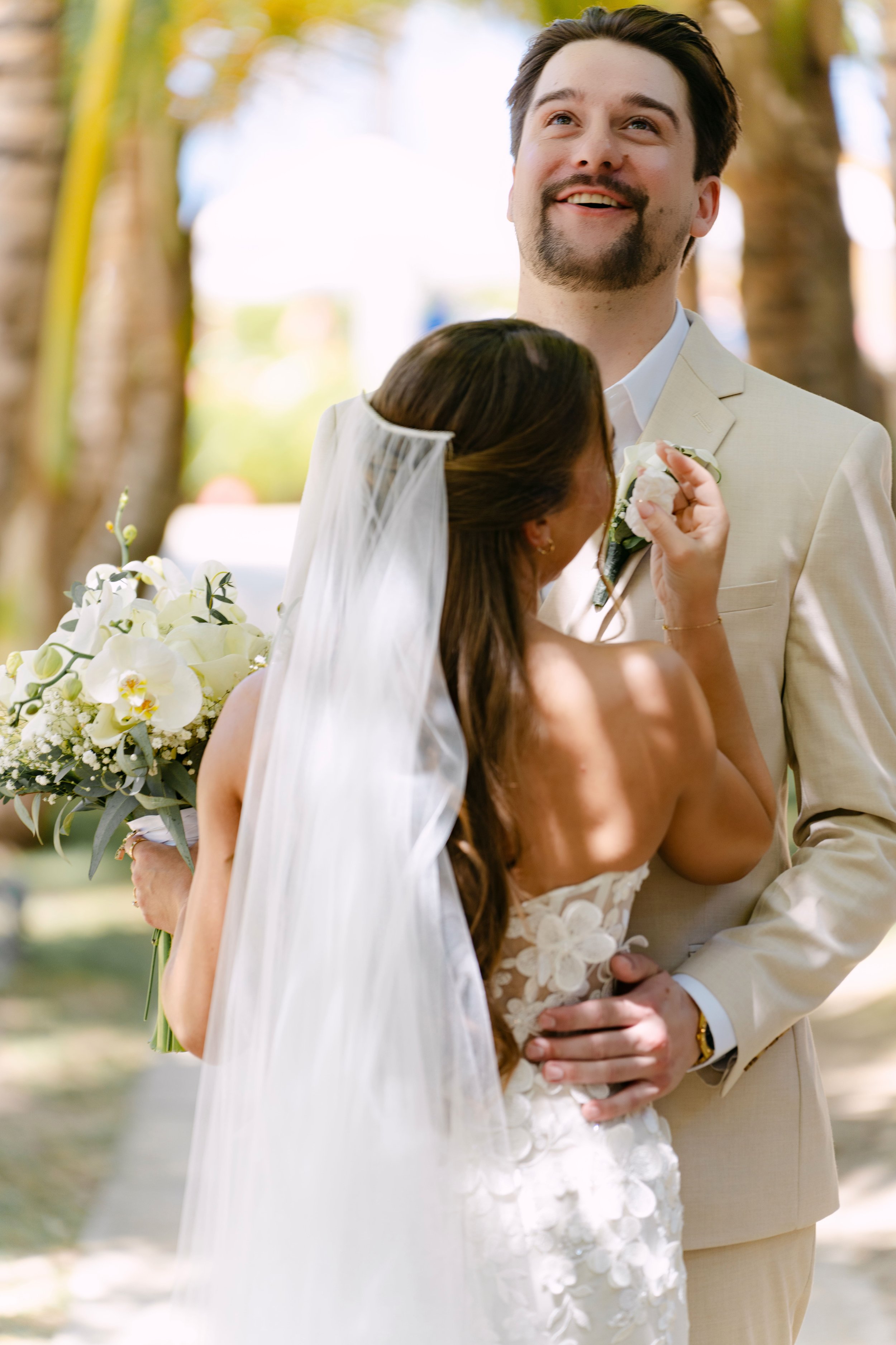 Groom laughing emotionally as he sees his bride during their Punta Cana first look