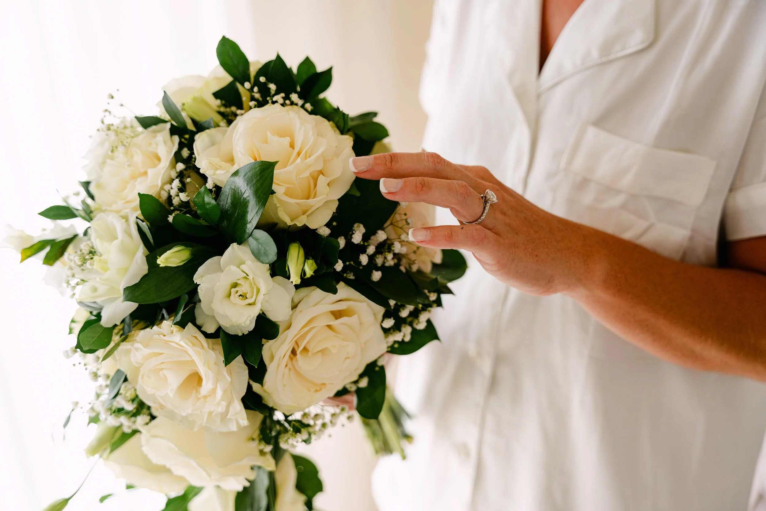 secrets-royal-beach-bride-white-rose-bouquet-getting-ready.jpg