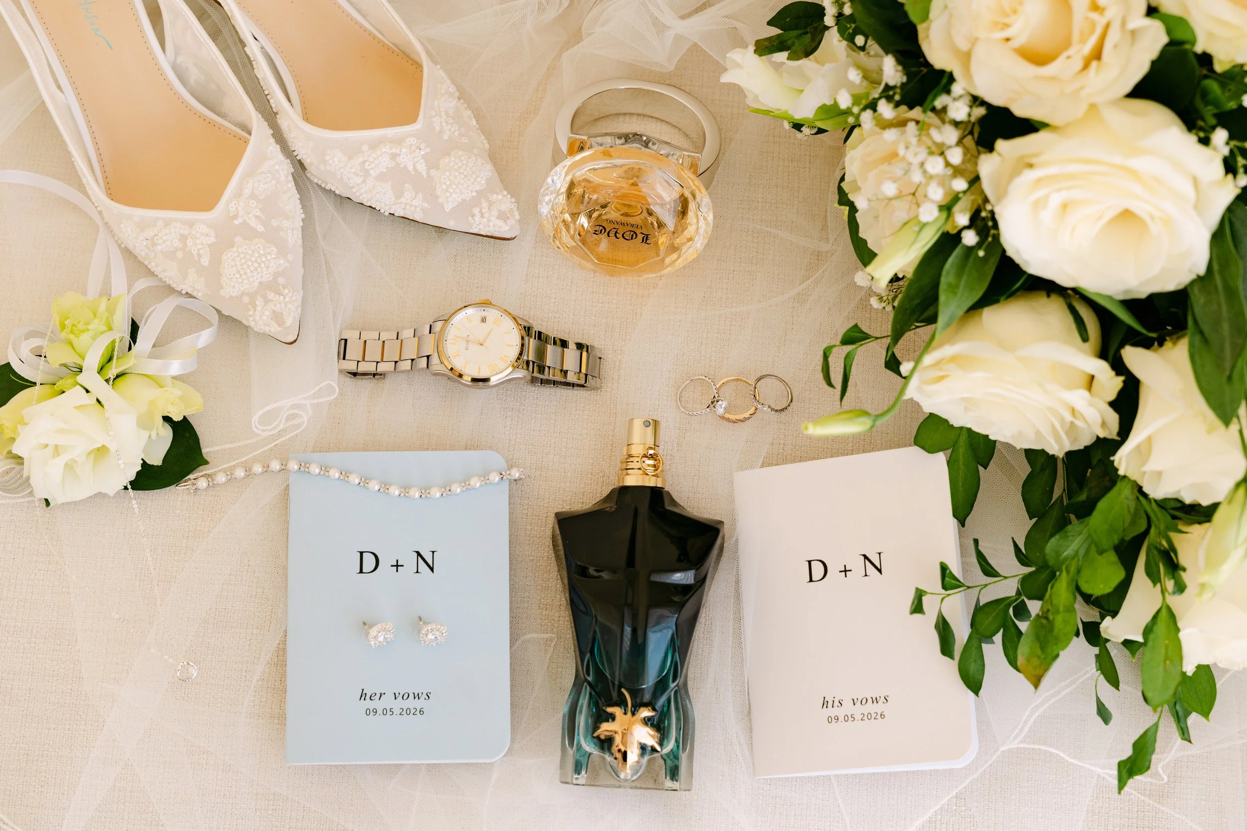 secrets-royal-beach-wedding-stationery-flatlay-white-roses.jpg