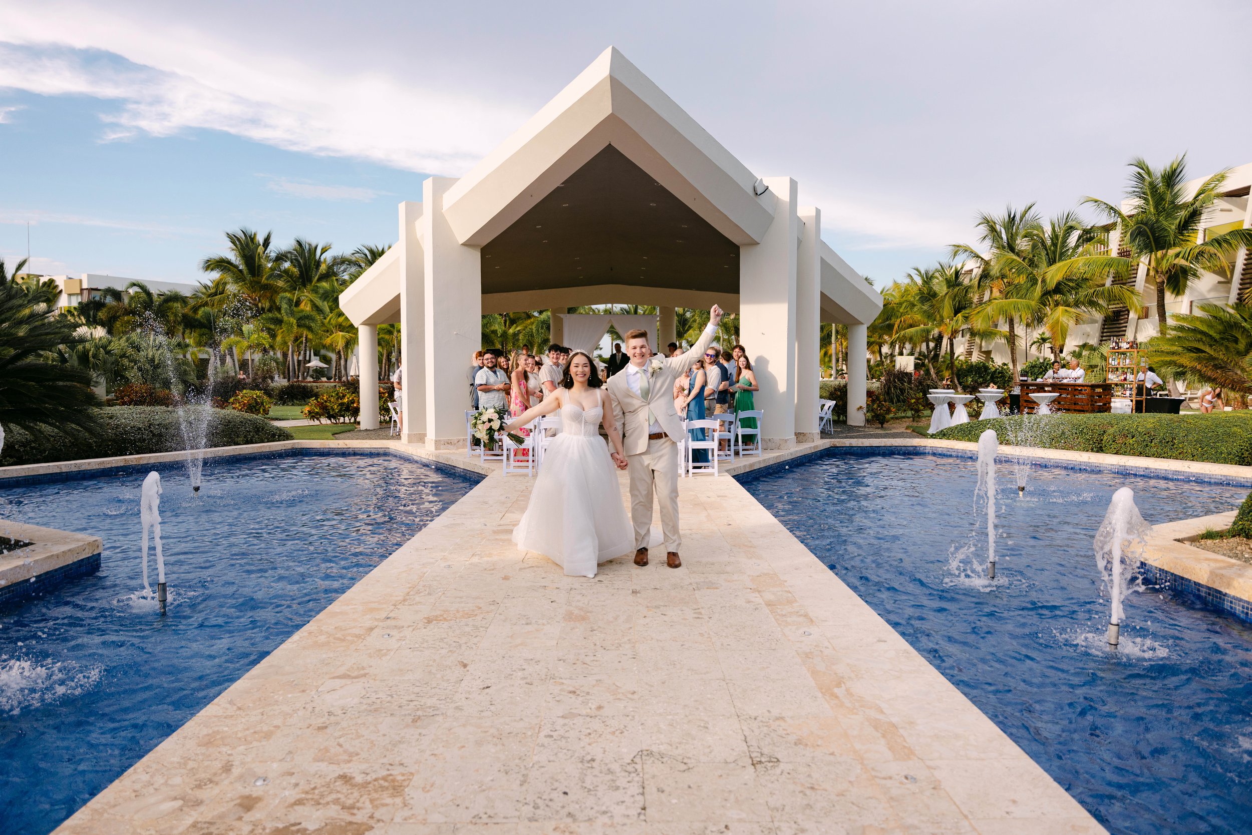 Modern gazebo wedding ceremony beside a reflecting pool at Dreams Onyx in Punta Cana