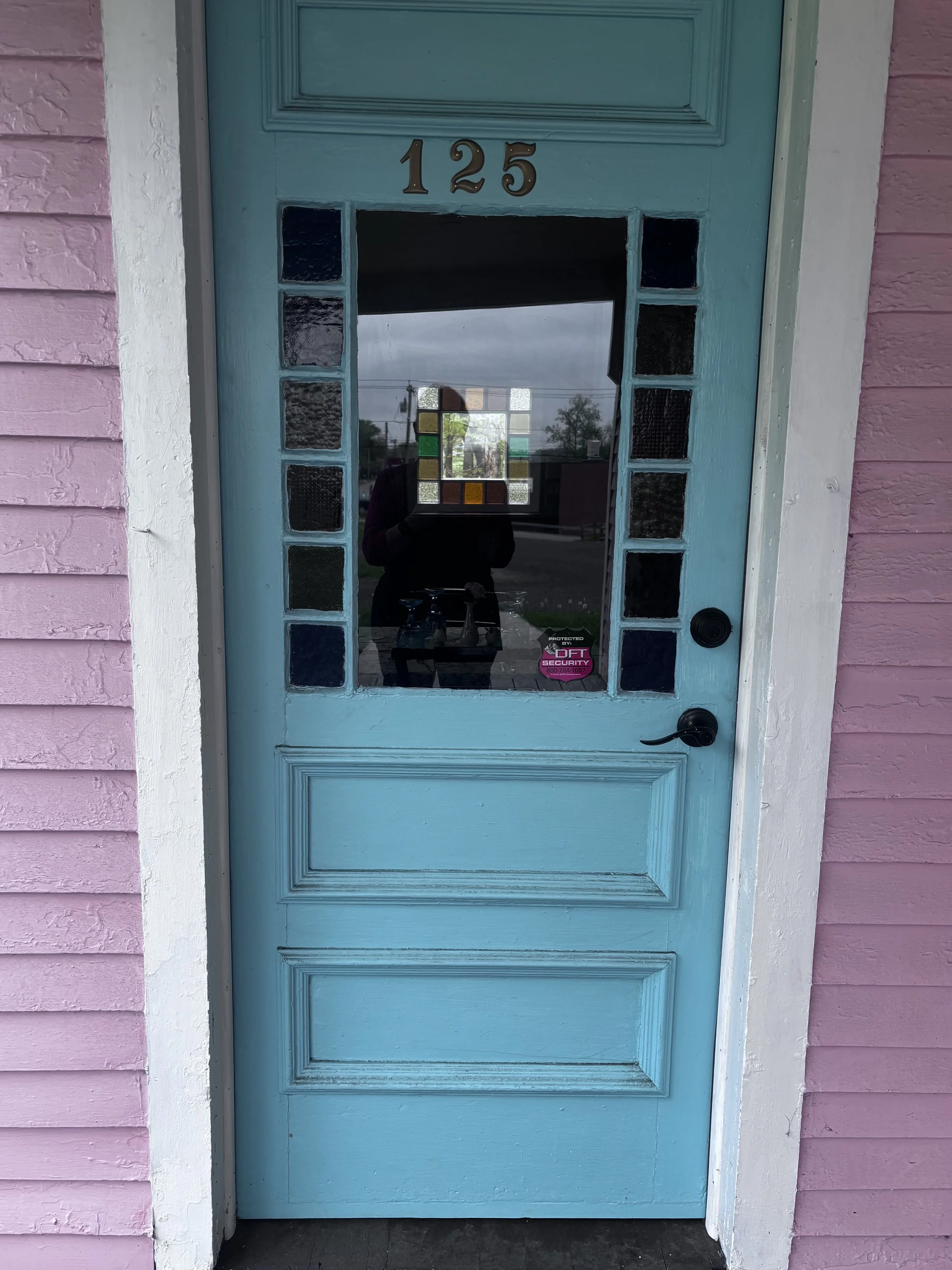 The original front door with addition of house numbers duplicated from a rubbingl