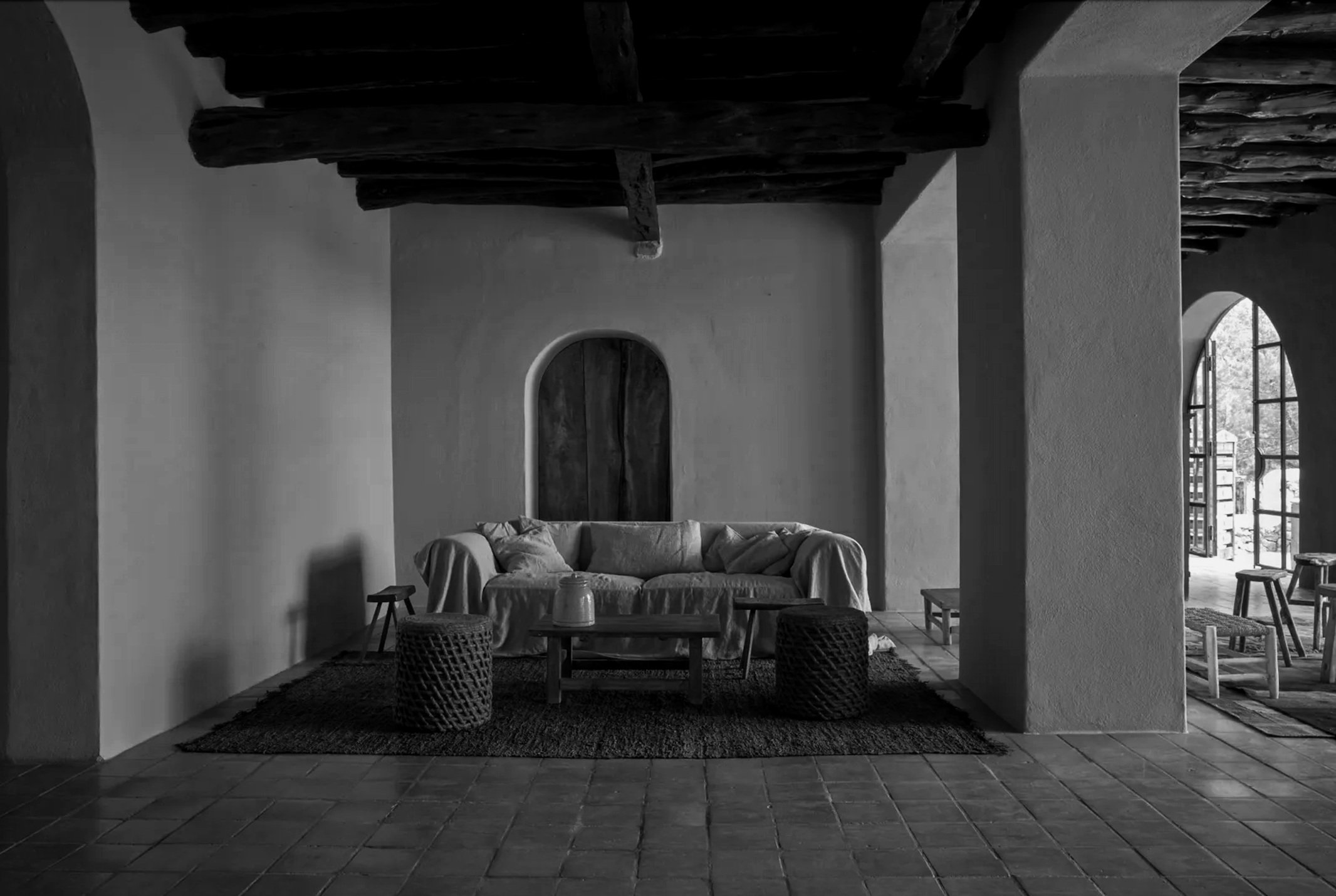 Interior view of La Granja in Ibiza, showcasing rustic decor with natural materials and cozy ambiance.