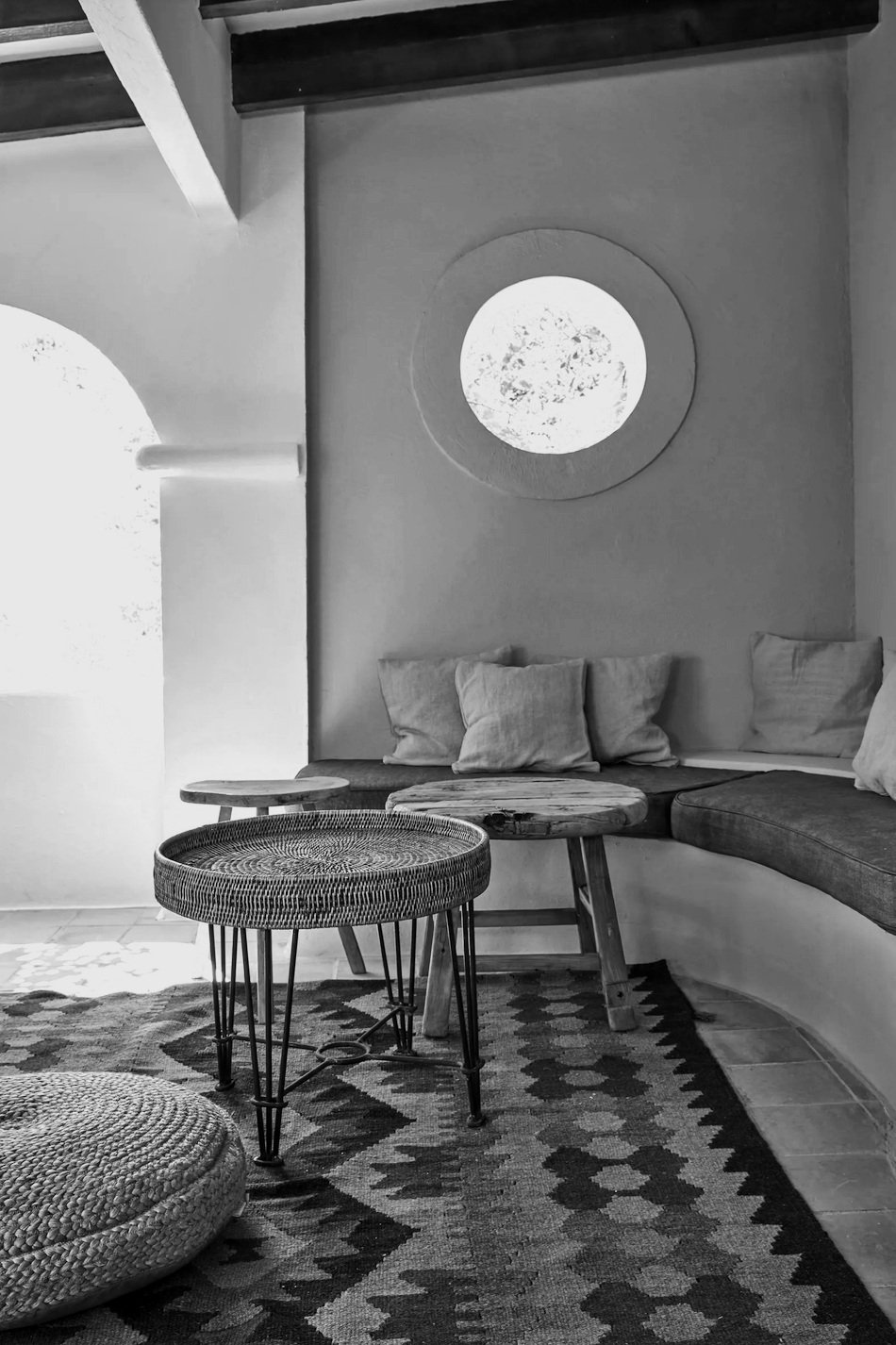 Interior view of La Granja in Ibiza, showcasing rustic decor with natural materials and cozy ambiance.