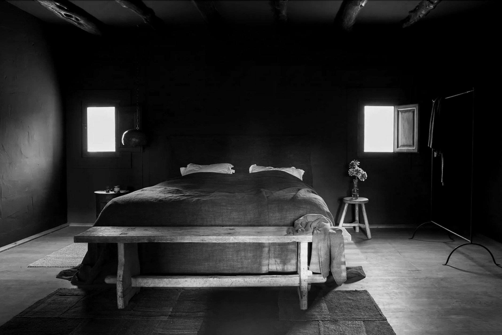 Guest room at La Granja in Ibiza, with minimalist design and natural light, offering a tranquil retreat.
