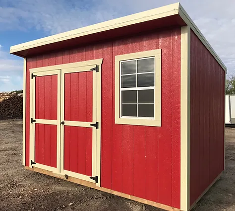 Red storage shed with double doors and a window
