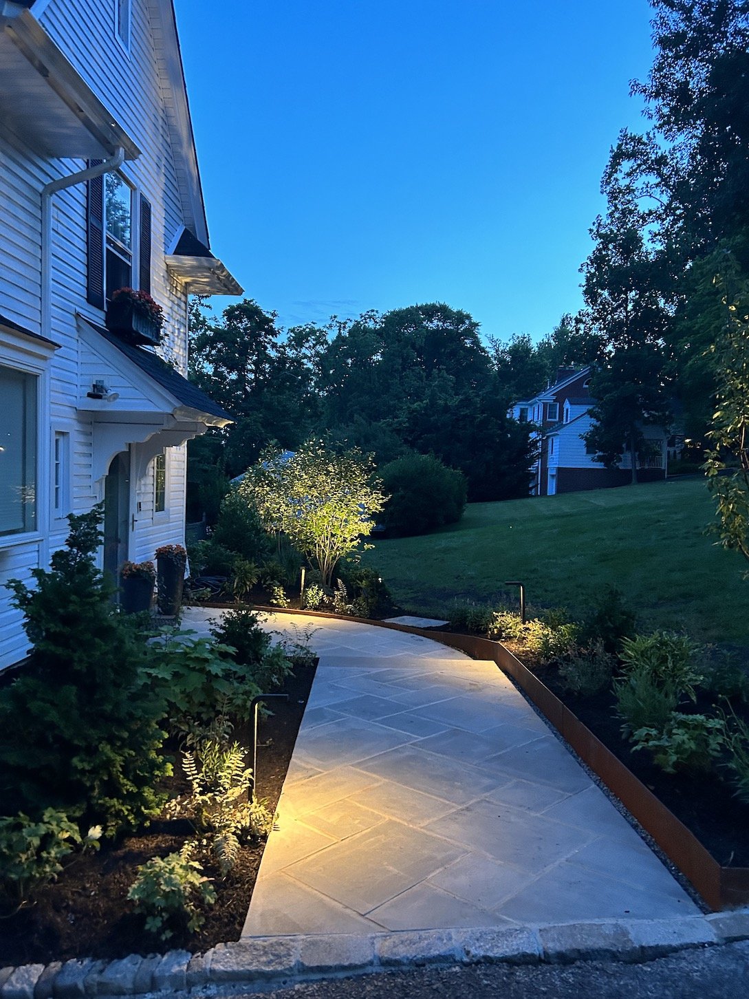 Entryway outdoor lighting to highlight walkway and home entrance with beautiful landscaping.jpg