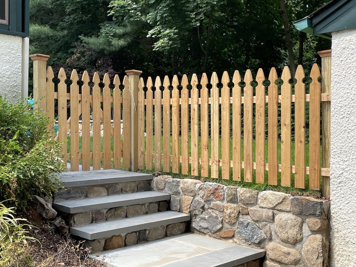 Standard Picket fence with gothic top made with natural wood and custom designed.JPEG