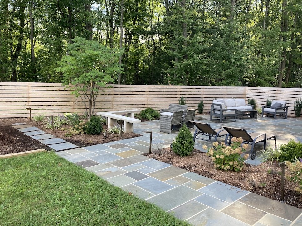 Horizontal backyard fence custom designed with natural wood to create an outdoor oasis living space for northern nj family.jpg