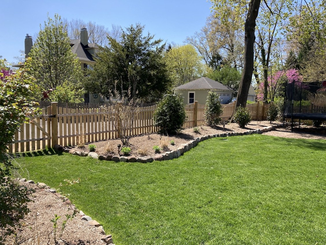 Traditional fence and native plantings landscape design for north new jersey home.jpg