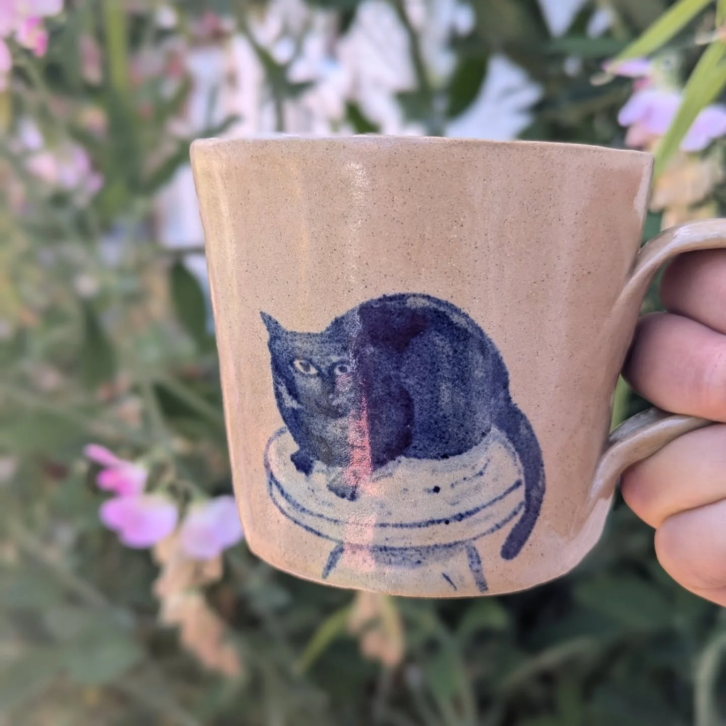 A mug I made for my mum's birthday of her cat Motsi 🐈&zwj;⬛