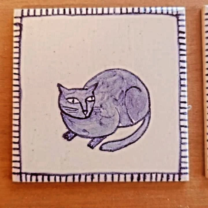 New tiles fresh from the kiln 🐾✨ Featuring a mischievous cat inspired by my mum&rsquo;s feline friend and some fiery dragons in honour of my grandma&rsquo;s magical artwork 🐉
I will be selling these at my upcoming markets - Salisbury Art Scene 2nd 