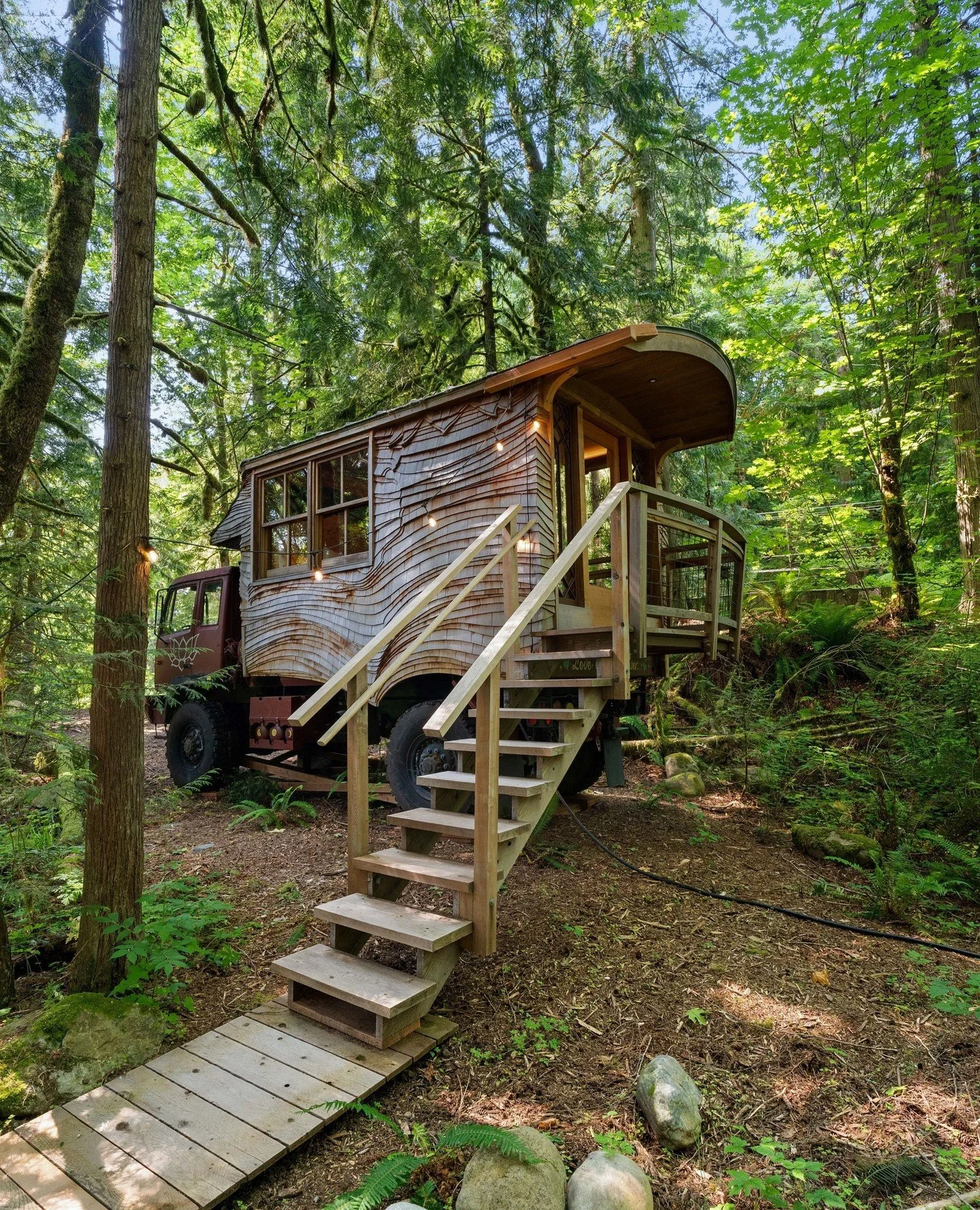 The sun's out, windows are down, and that means it's nearing road trip season! 🛻✨️ ⁠
⁠
Name a groovier place to rest than the Lovebomb, our upcycled army truck turned cozy stay! Send this to a friend you want to stay here with🌈🌲⁠
⁠
Link in bio to 