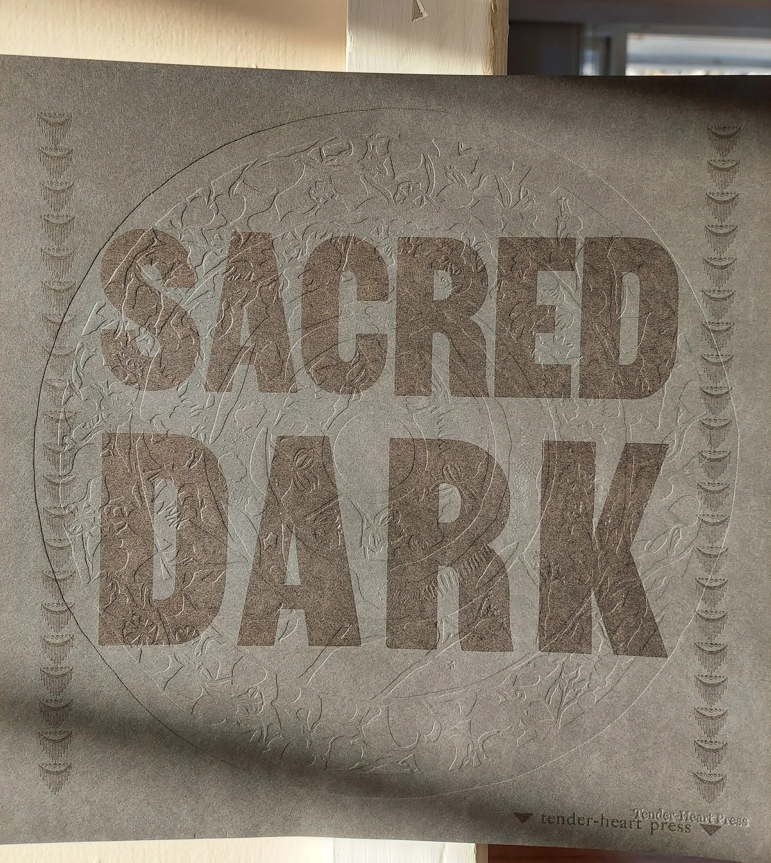 Sacred Dark Embossed.jpg