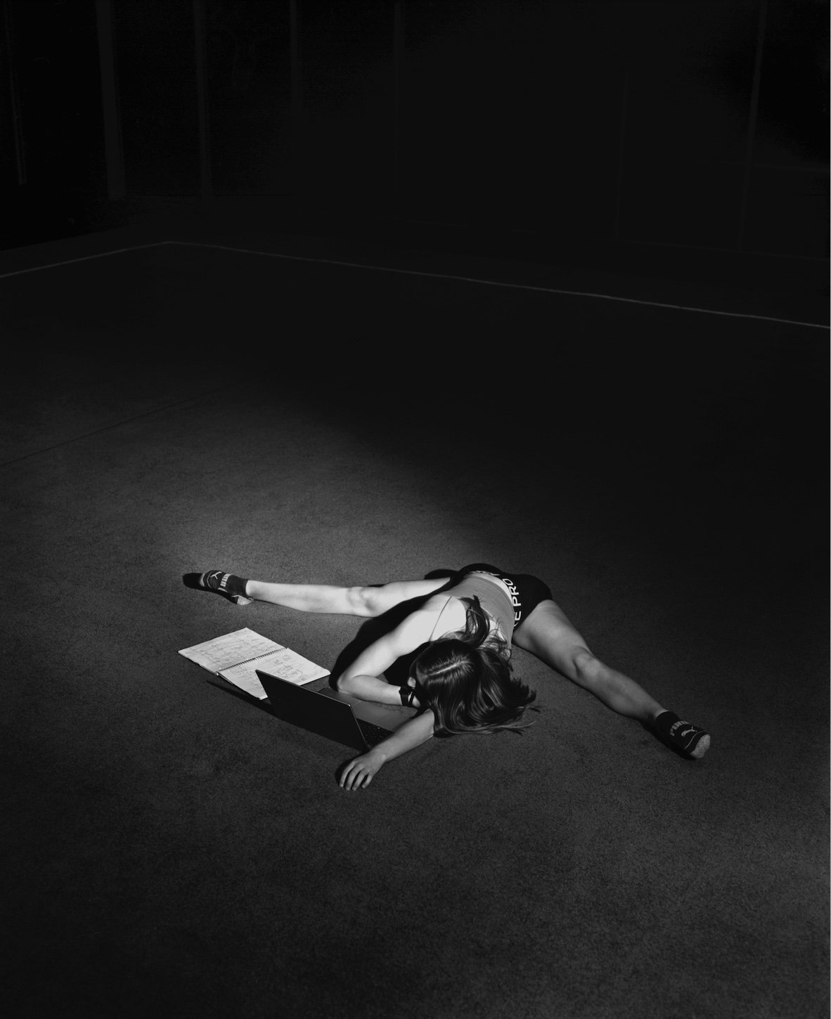 Untitled (Carley)
Practice ranged anywhere from four to six hours after school. Gymnasts will multi-task homework while stretching for a long practice ahead, with minimal time after practice to complete work.