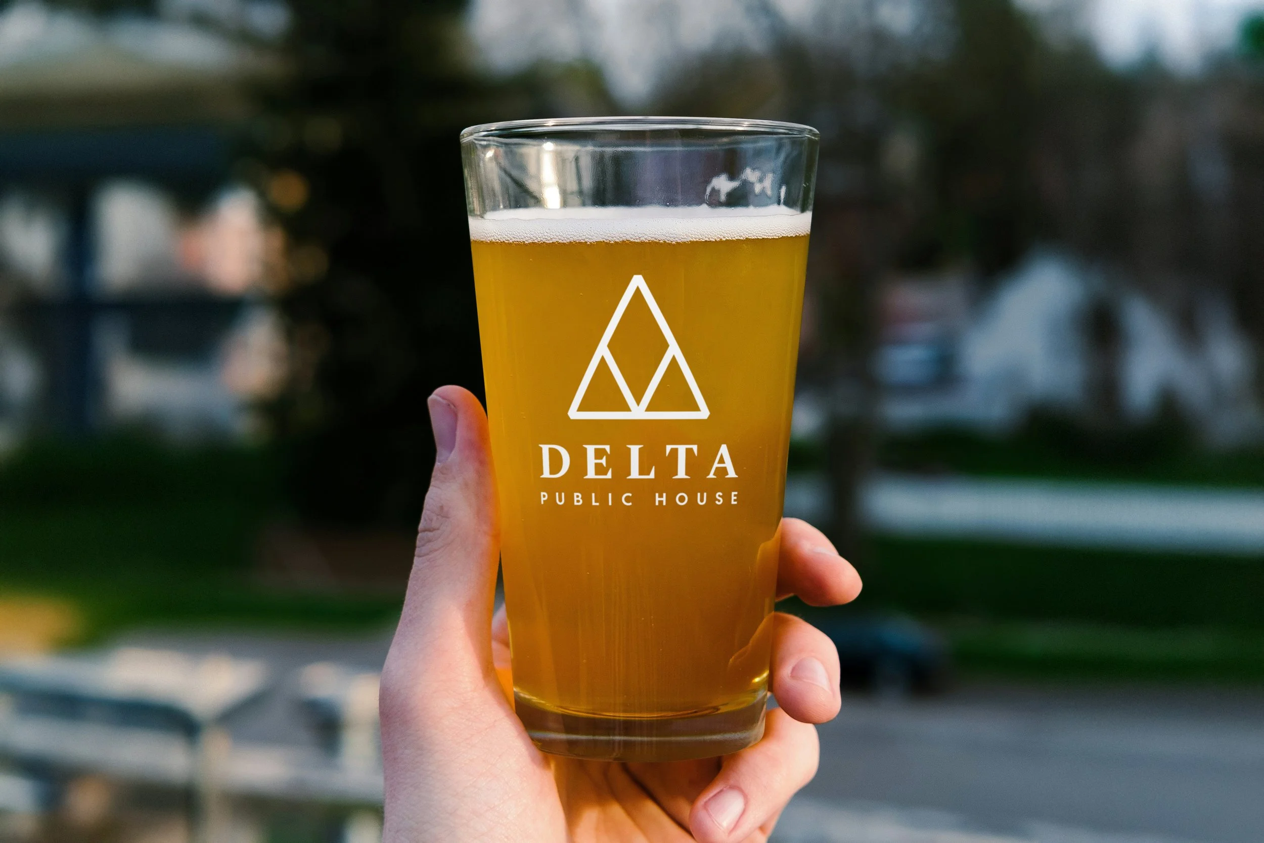 Beer Glass in Hand Mockup.jpg