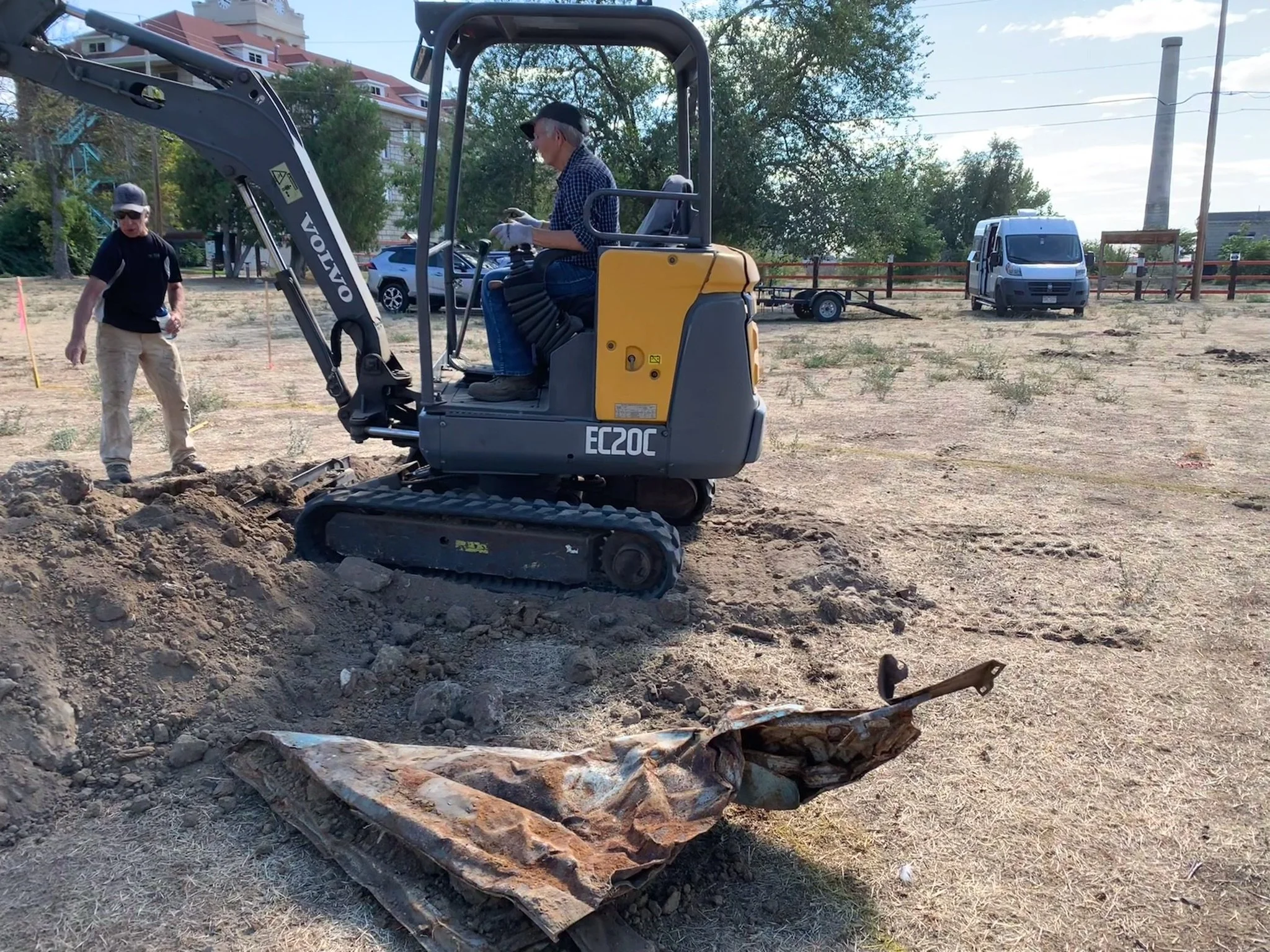 Jeff Fereday (Guitar) & Marsha Schoeffler (Fiddle) digging out an old car door and other burried treasures from underneath Stickerville.