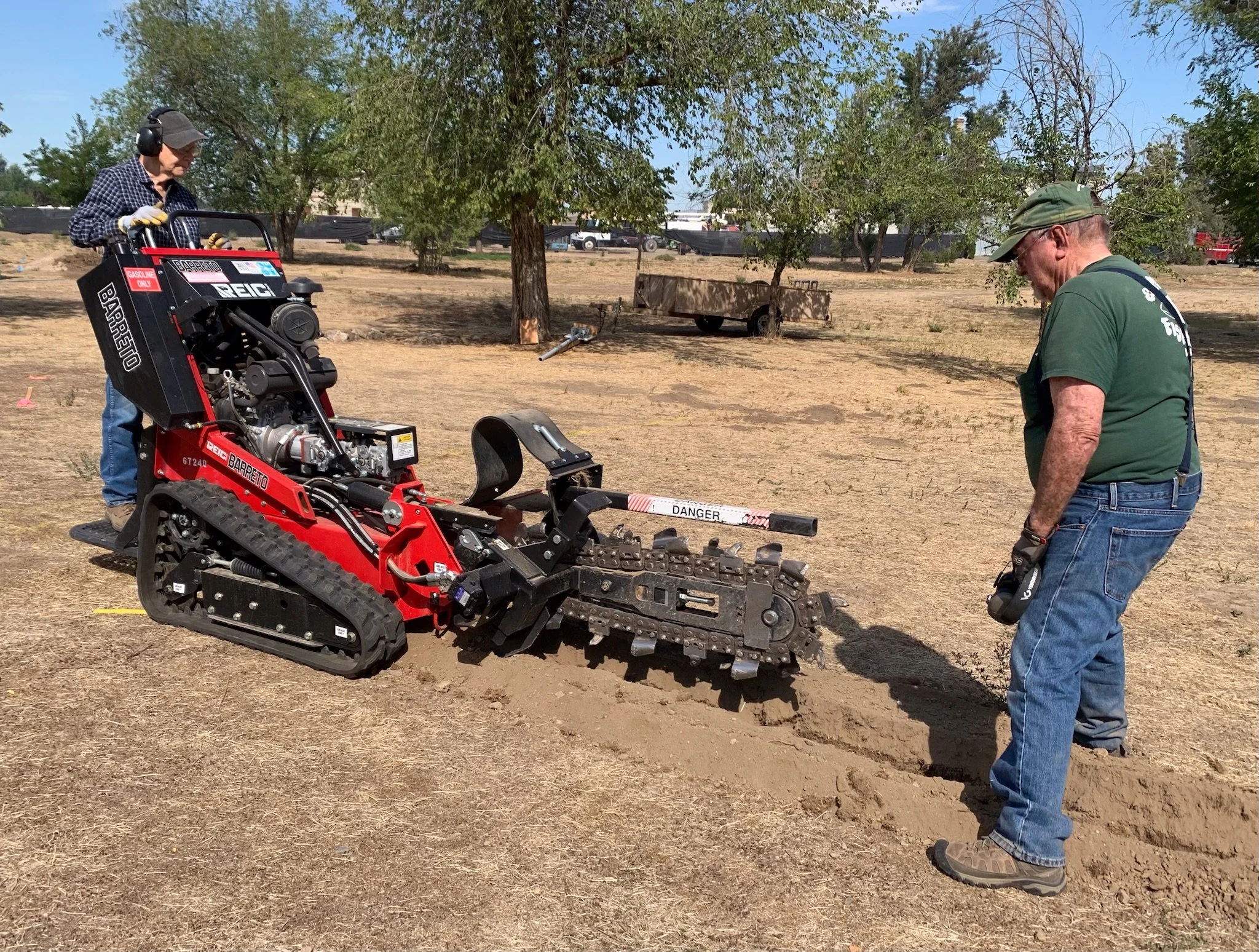 Marsha Schoeffler & Bill Siems trenching for the electrical line. Thank you to Chad's Rentals for giving us a great non-profit rental rate for using this trencher. 