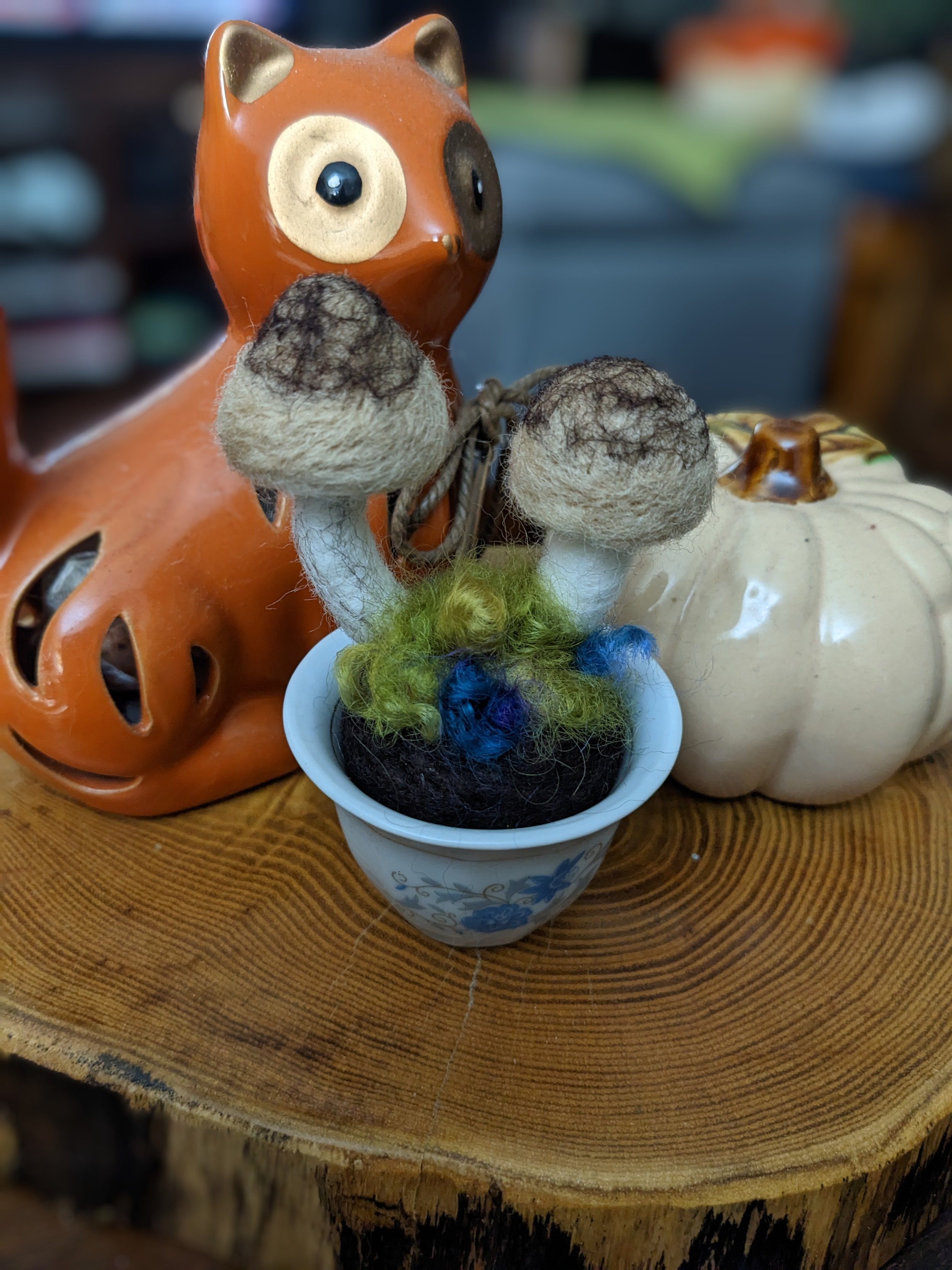 needle felted small brown mushrooms in a tea cup