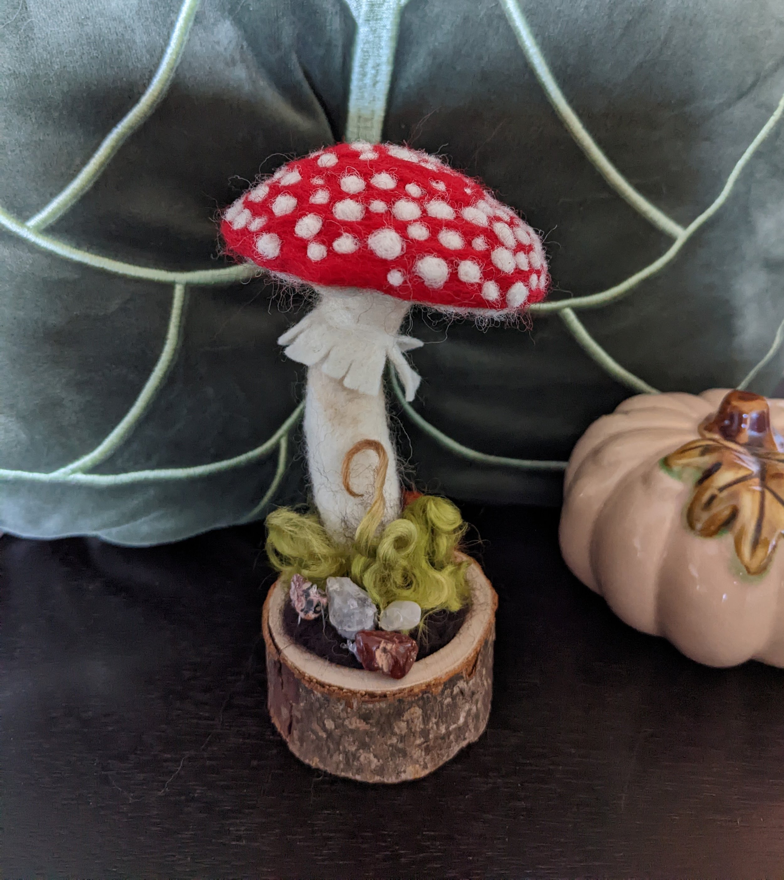 needle felted red-cap mushroom with small crystals