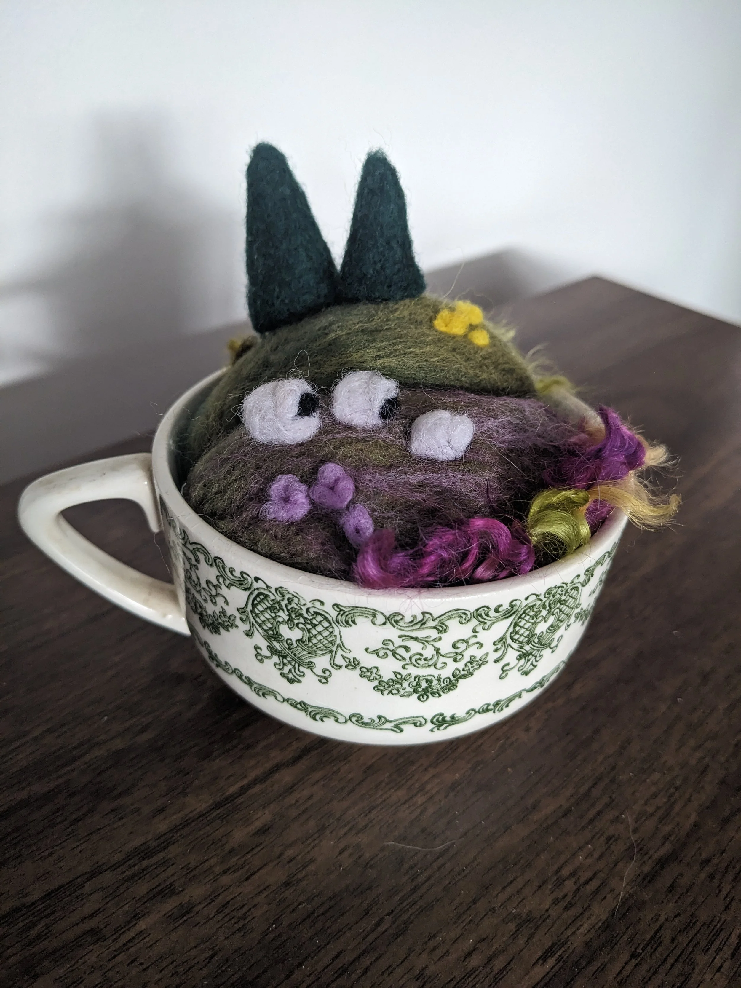 Needle felted sheep in a field