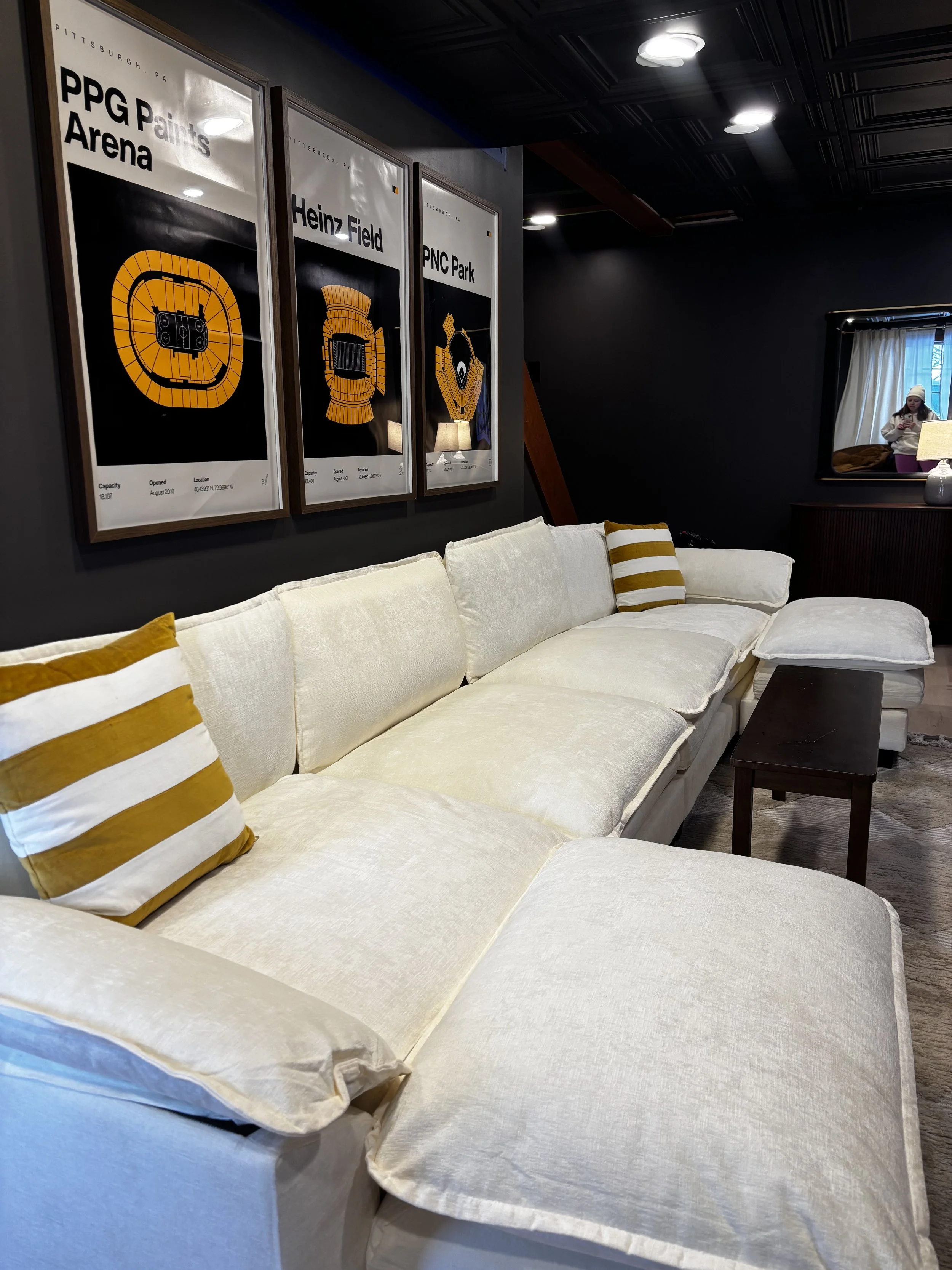 seating area with cream couch and gold accents