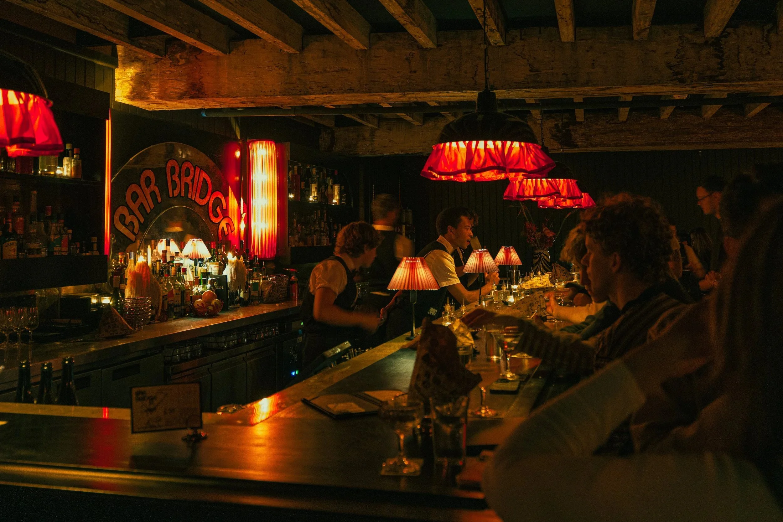  BAR BRIDGE  
  6 Bridge St, Sydney NSW 2000  Intimate cocktail bar tucked beneath the city streets, serving drinks and late night vibes. 
 DISCOVER 