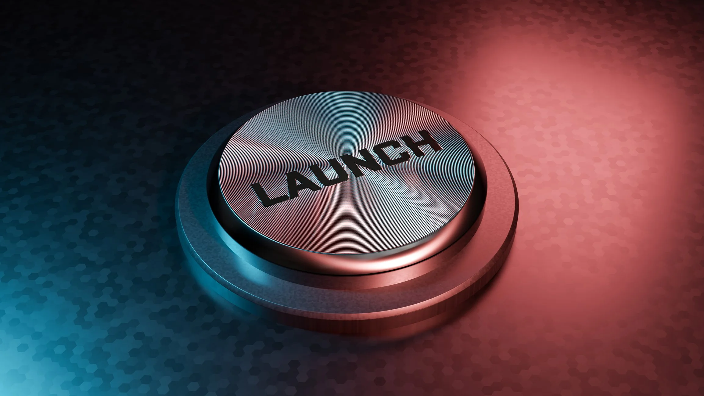 Close-up of a metallic button with the word 'LAUNCH' written on it, illuminated with red and blue lighting.
