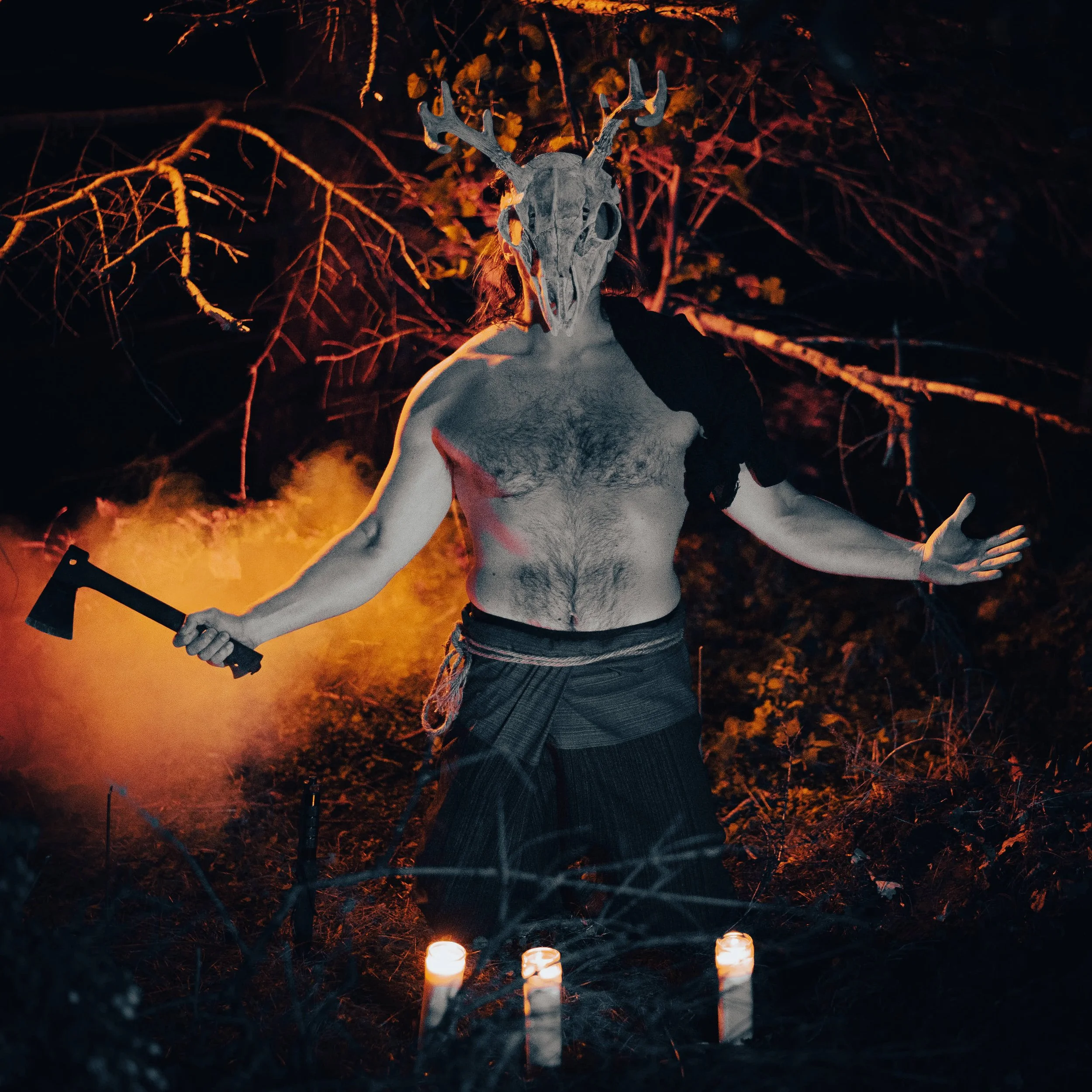 a scary character with a goat skull head poses in ritual Halloween style image photograph by Life Times Photography