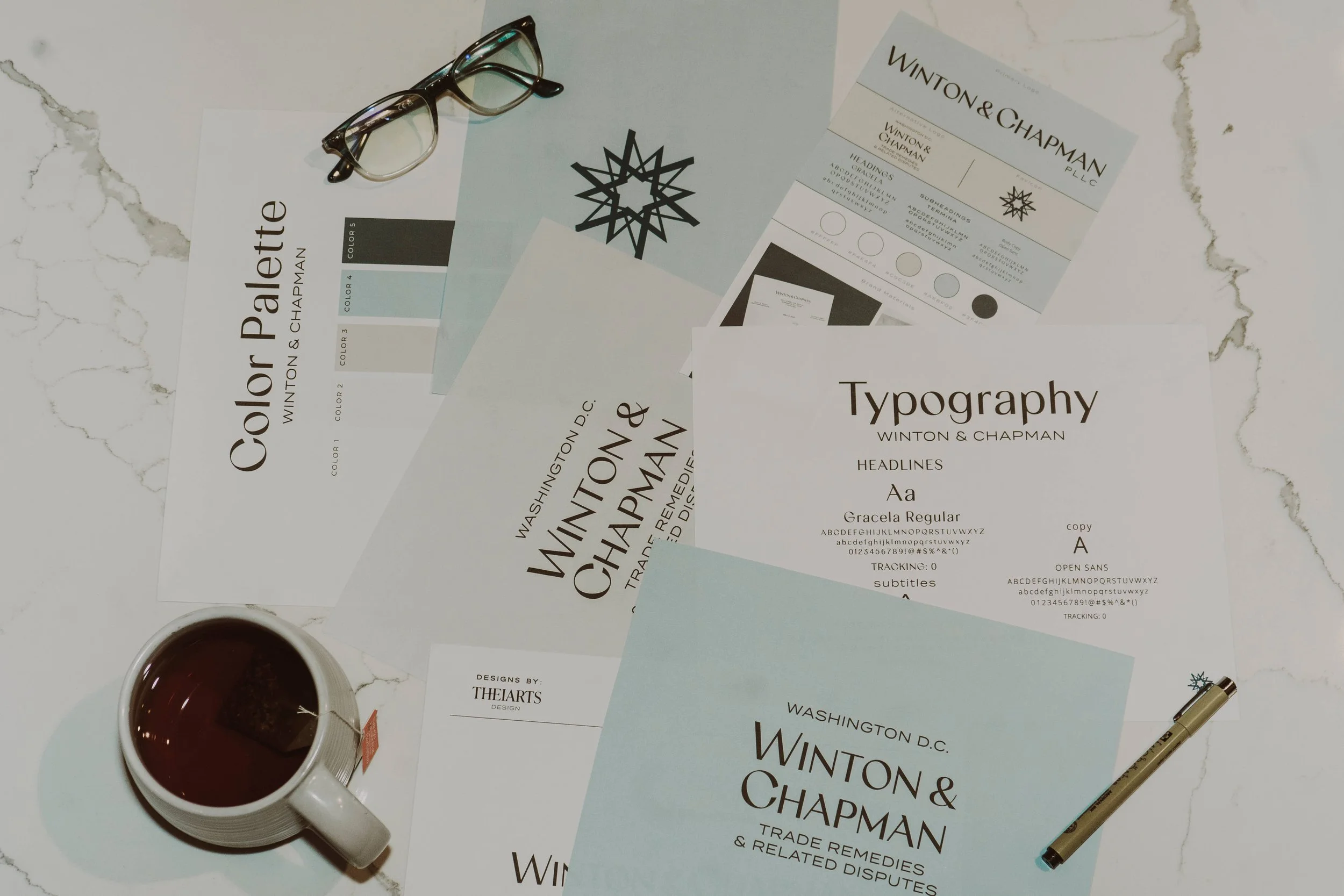 flat-lay spread of brand design mock-ups photograph by Life Times Photography