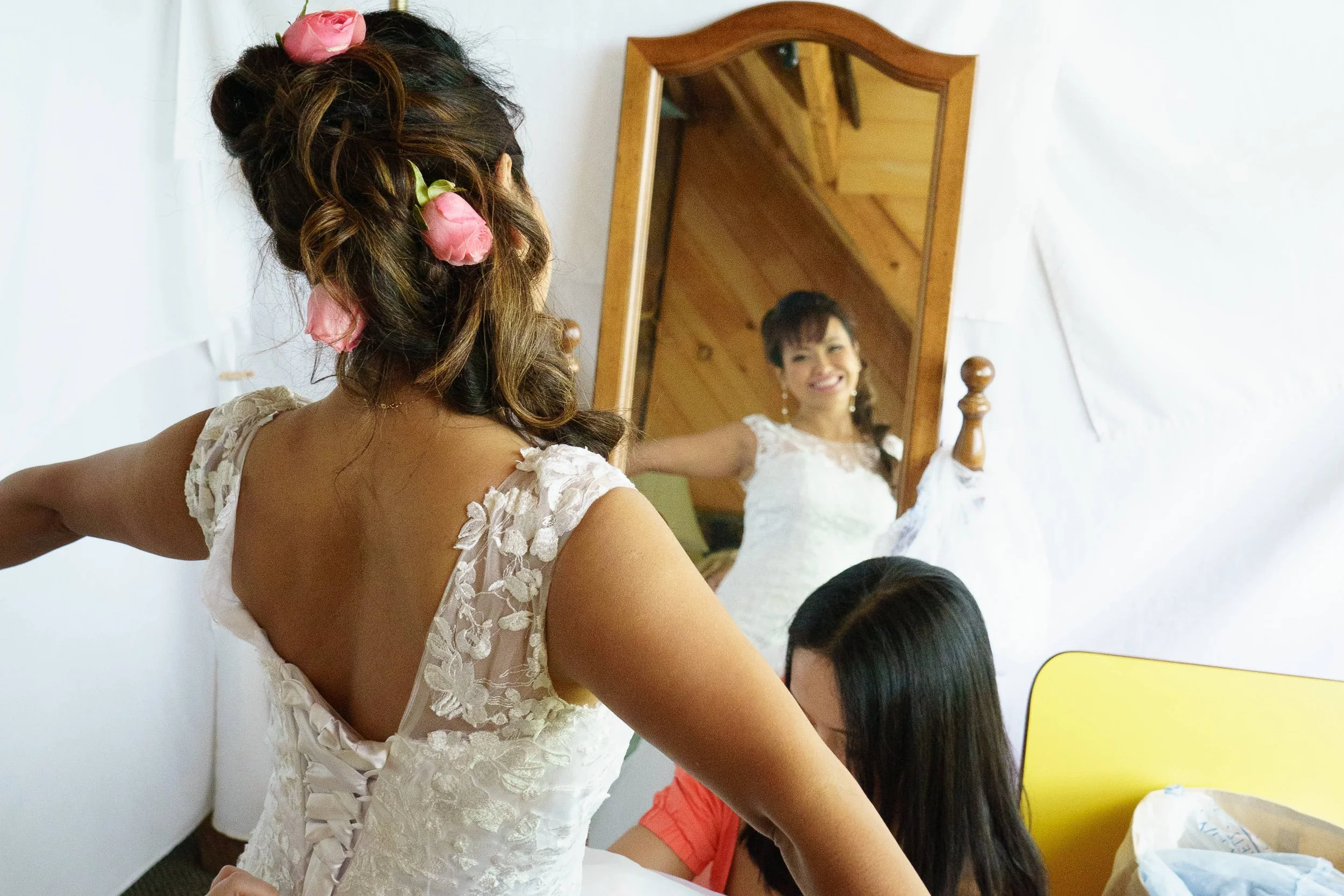 Bride getting ready reflected in mirror photograph by Life Times Photography