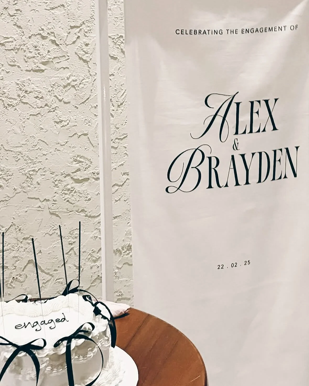 Celebrating Alex &amp; Brayden&rsquo;s engagement at @lolastkilda_ with a touch of modern elegance 🤍

We loved creating this custom linen welcome sign for their special day. Classic, timeless, and oh-so-romantic! 🖤🥂 

#Engaged #EngagementParty #Cu