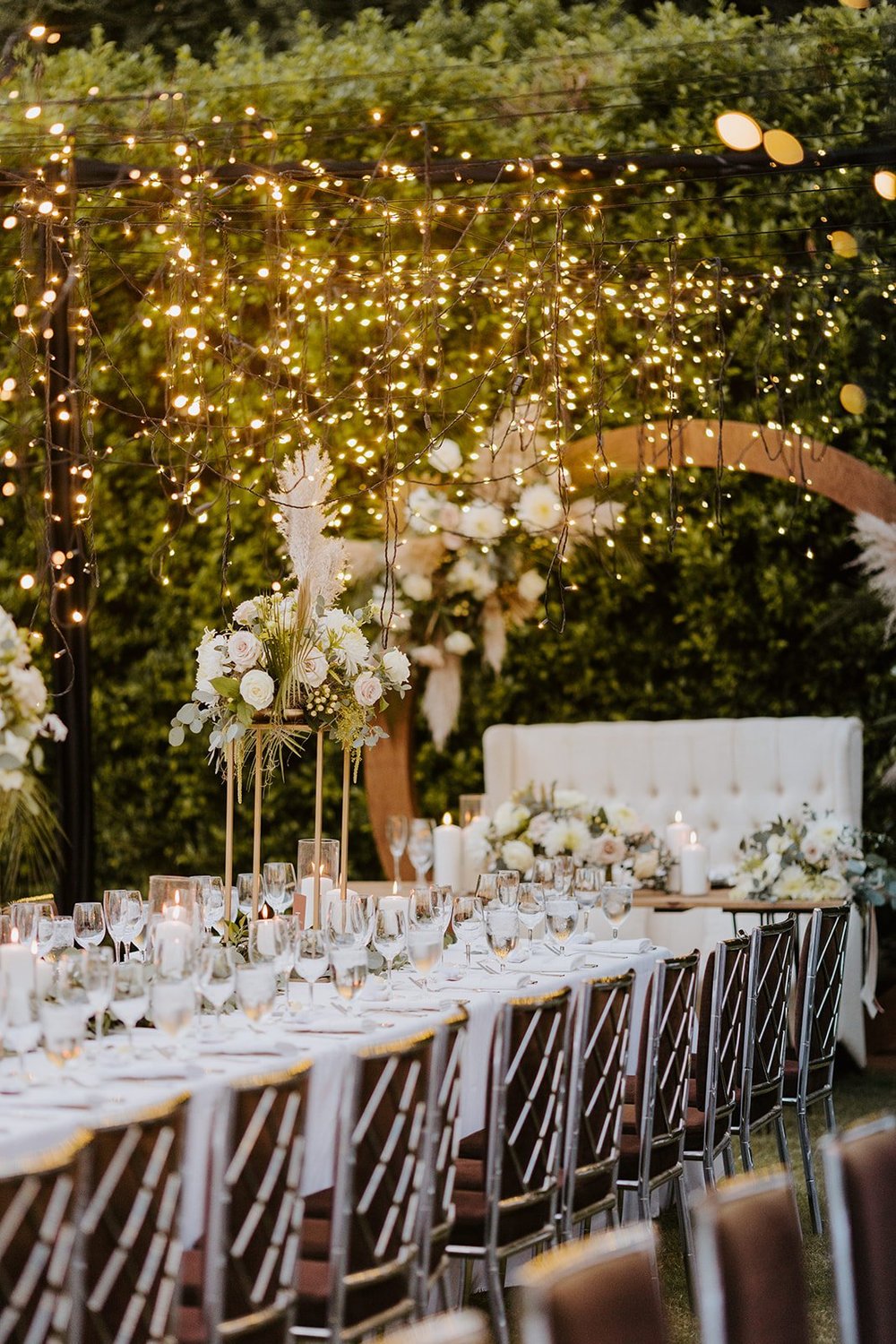 Wedding reception twinkle lights, tall centerpieces, boho pampas grass centerpiece, white candles, Parker Palm Springs Wedding reception, Photo by Tida Svy Photography