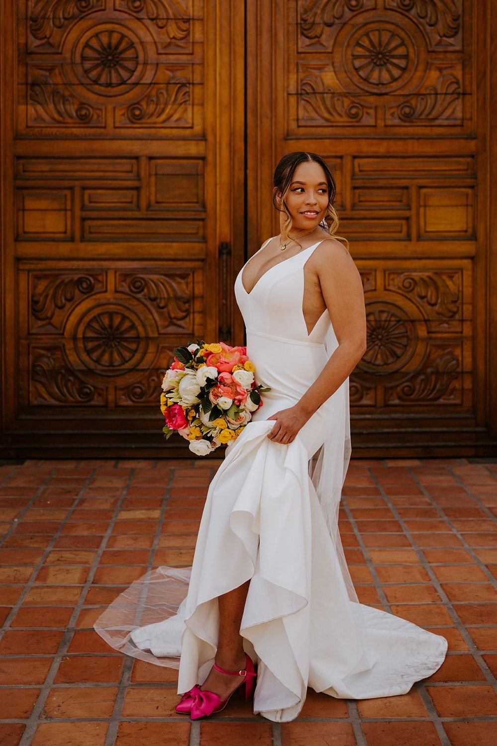 Bride with colorful bouquet at La Quinta Resort wedding in Palm Springs | photo by Tida Svy