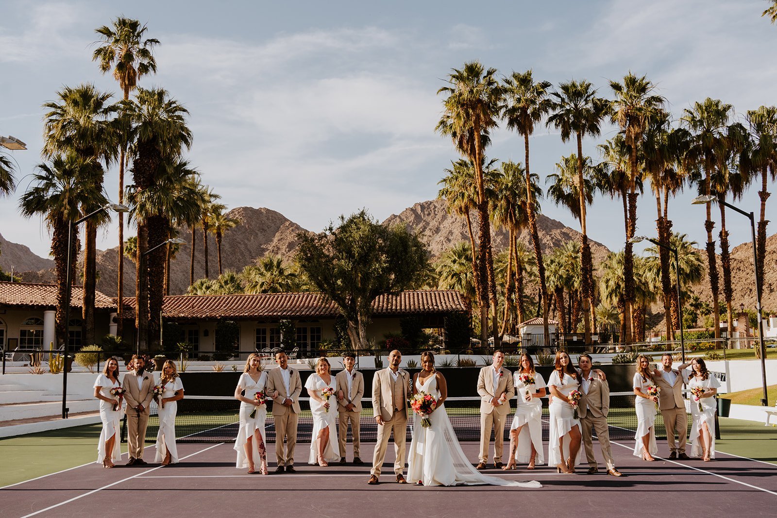 Wedding party photo at the tennis courts at La Quinta Resort in Palm Springs | photo by Tida Svy