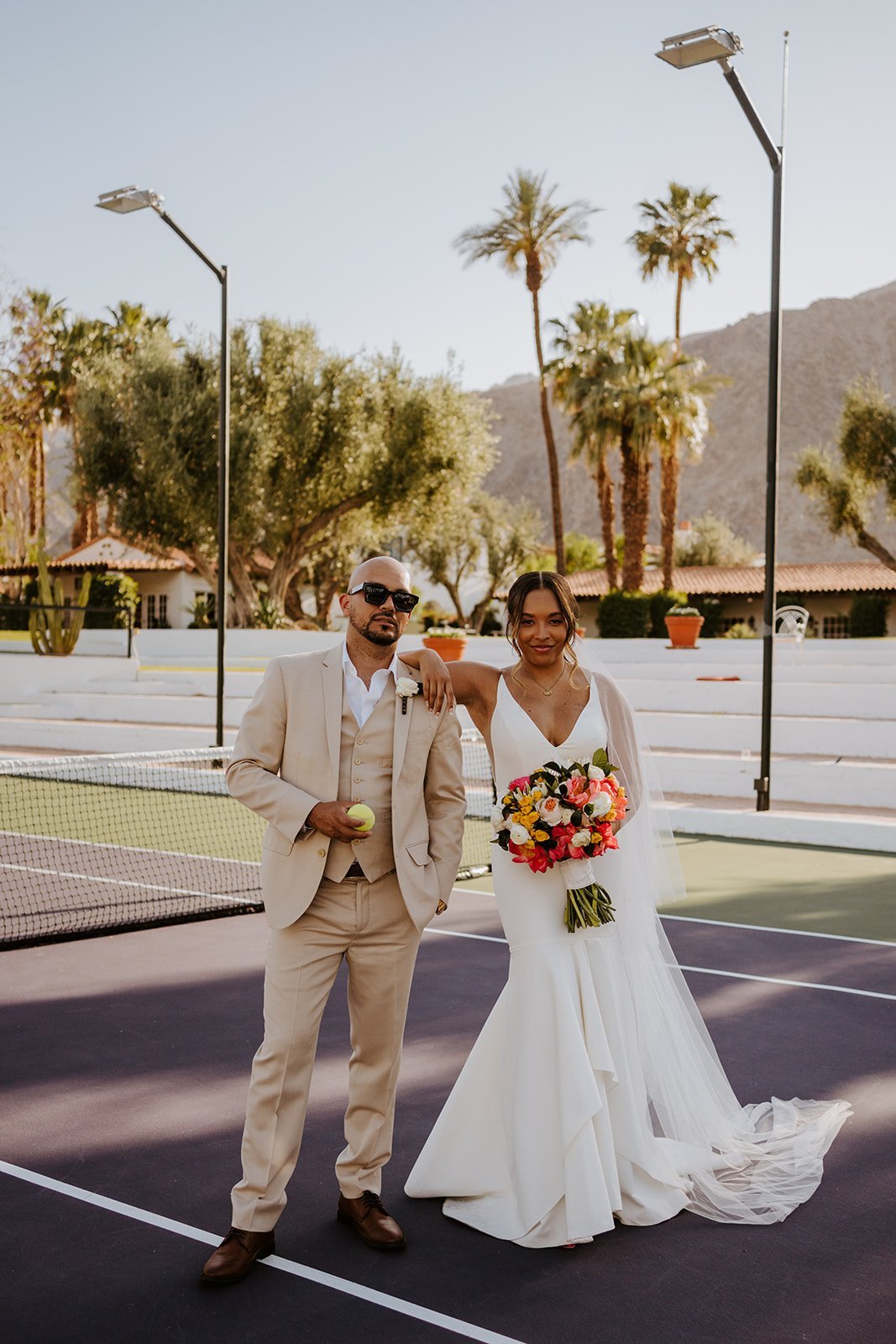 Bride and groom photos at the tennis courts at La Quinta Resort in Palm Springs | photo by Tida Svy